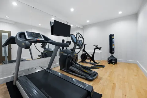 a view of a room with gym equipment