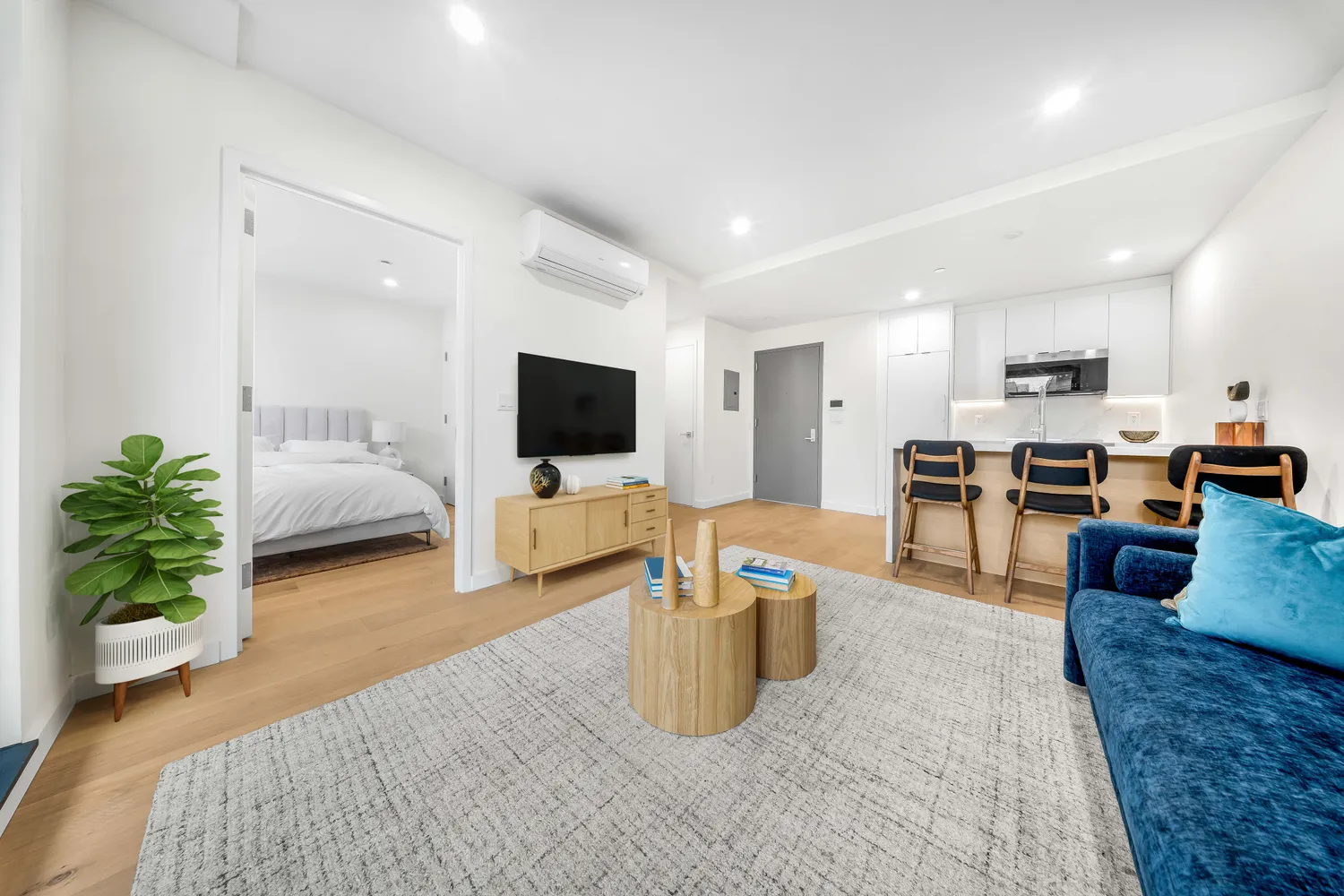 a living room with furniture and a flat screen tv