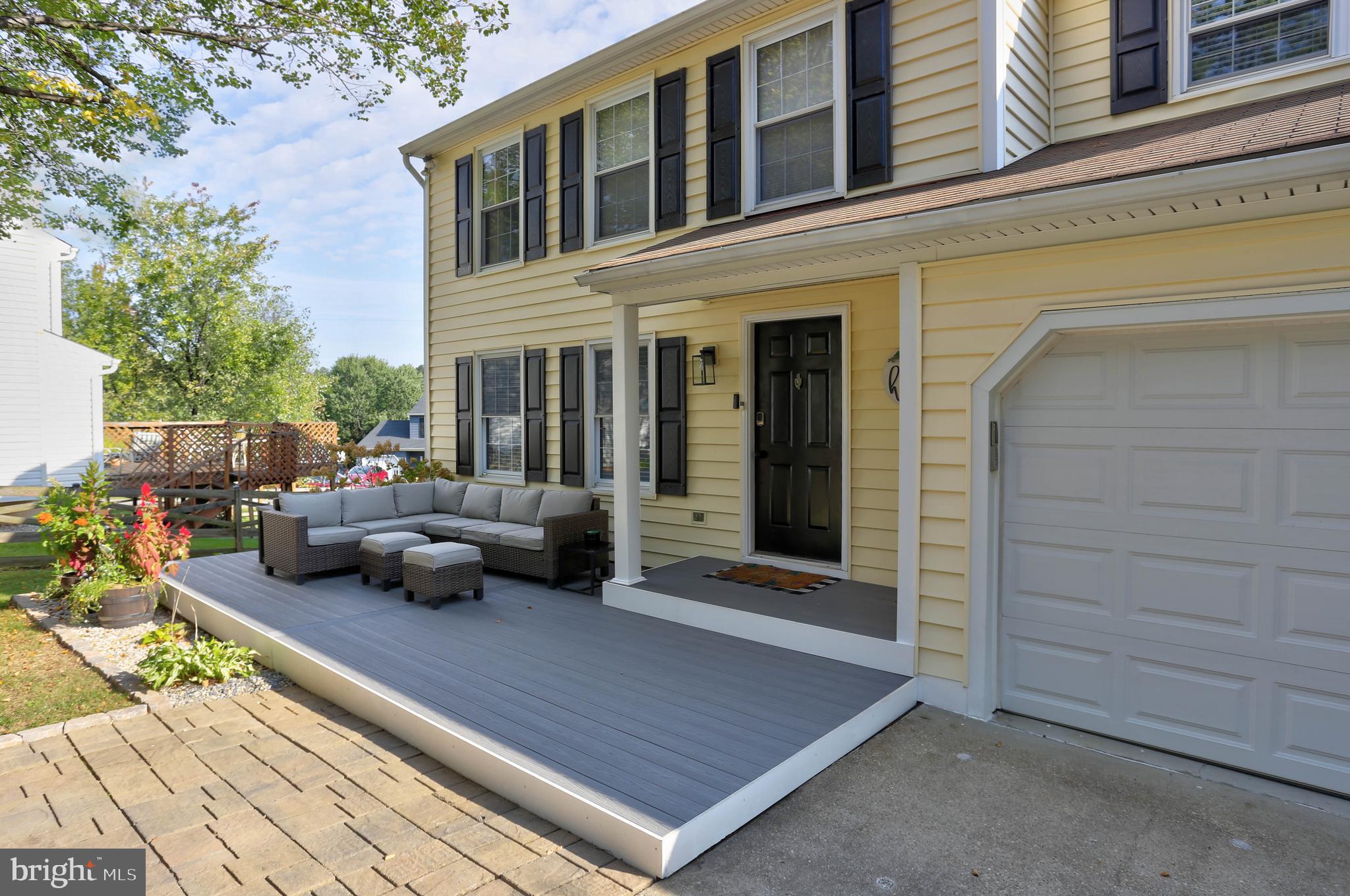 6257 Fairbourne Court Hanover, MD 21076 - Photo 6 of 47 a view of a patio with couches chairs and a potted plant