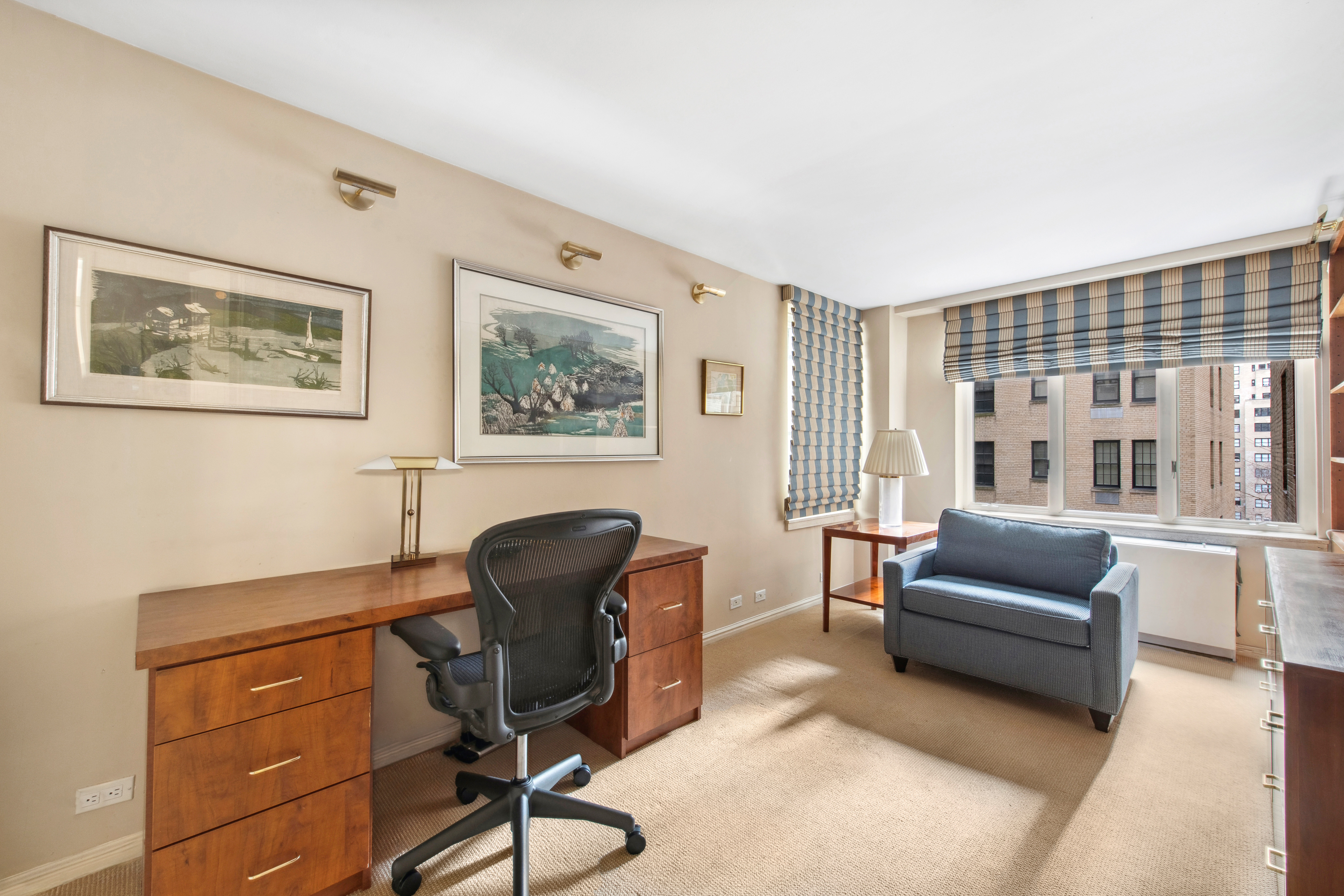 2 Sutton Place South, Unit 7F Manhattan, NY 10022 - Photo 11 of 18 a view of a livingroom with workspace and a couch