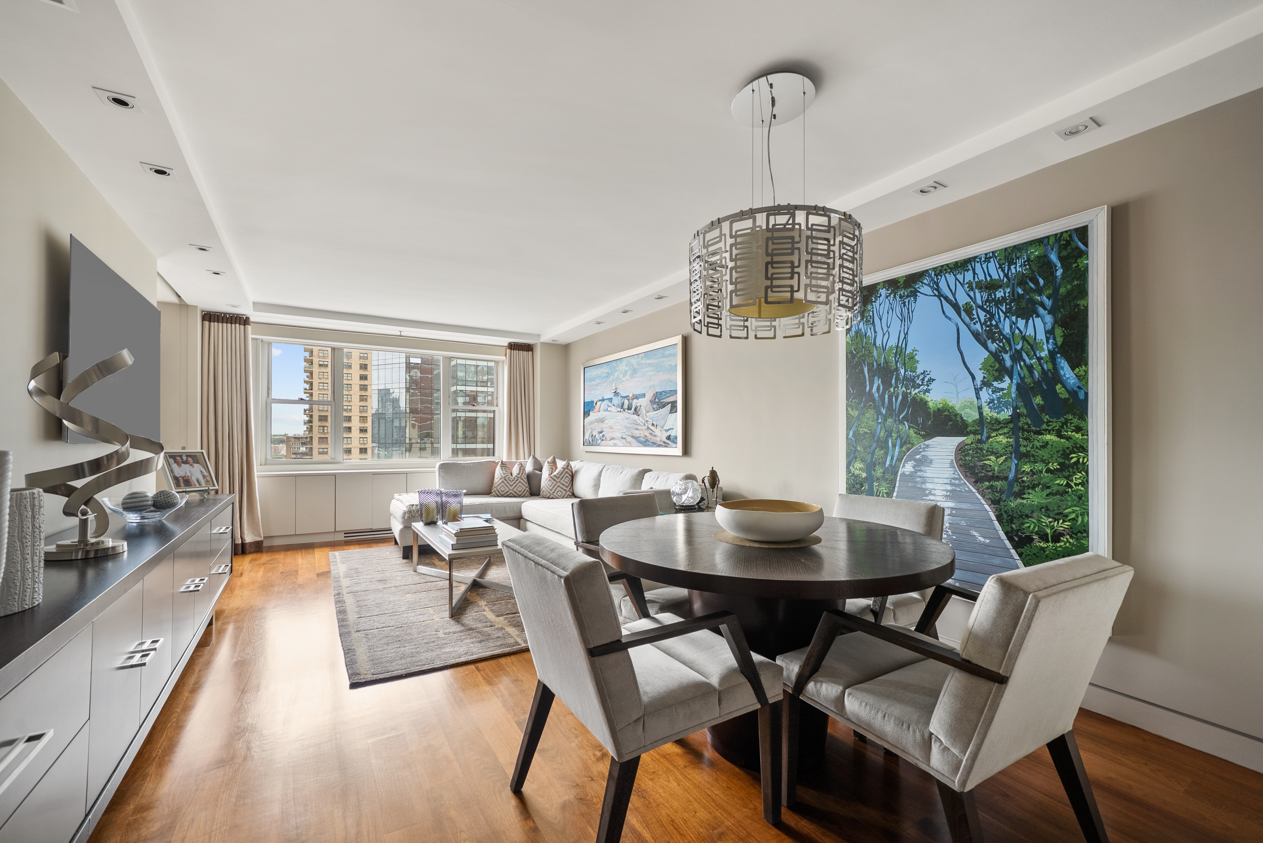 165 West 66th Street, Unit 18D Manhattan, NY 10023 - Photo 2 of 8 a view of a dining room with furniture window and outside view