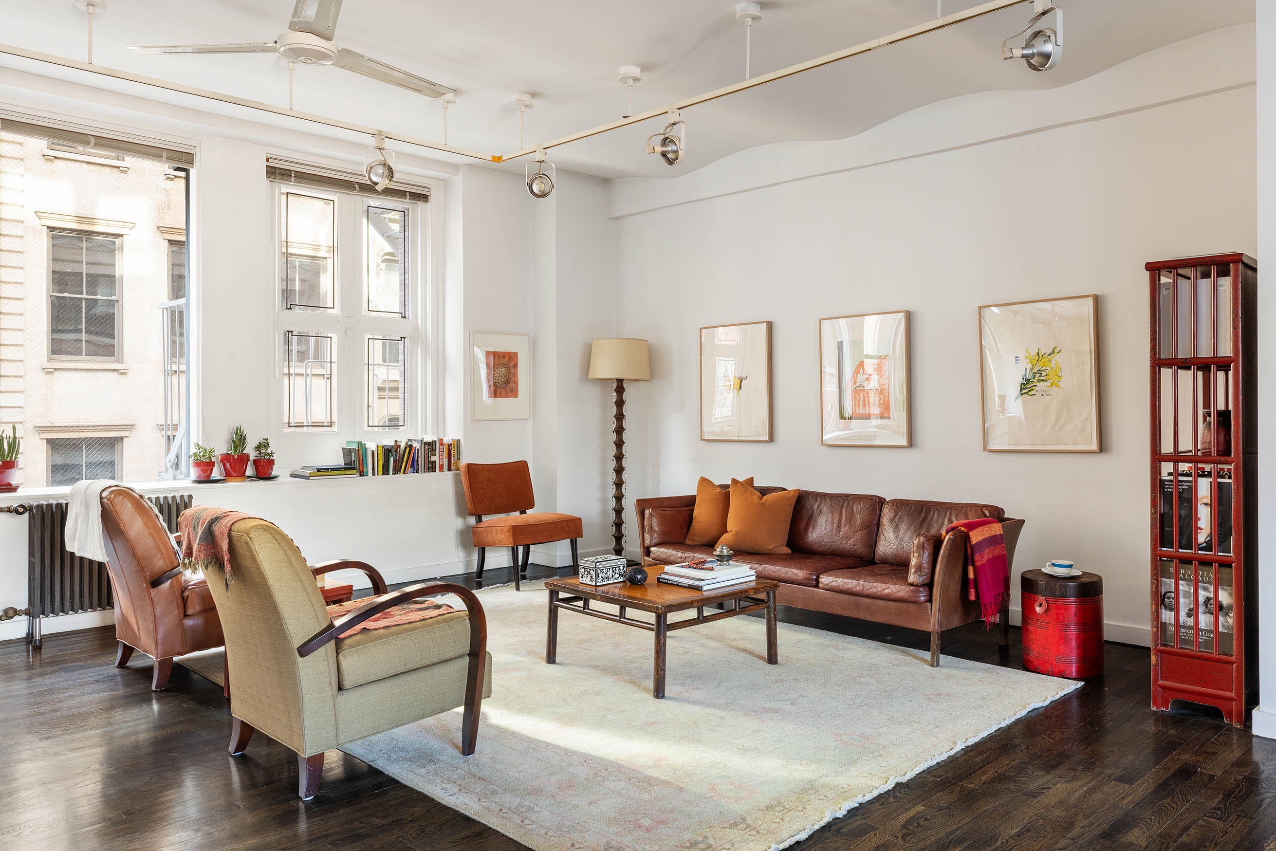 45 Lispenard Street, Unit 3E Manhattan, NY 10013 - Photo 3 of 13 a living room with furniture and a potted plant
