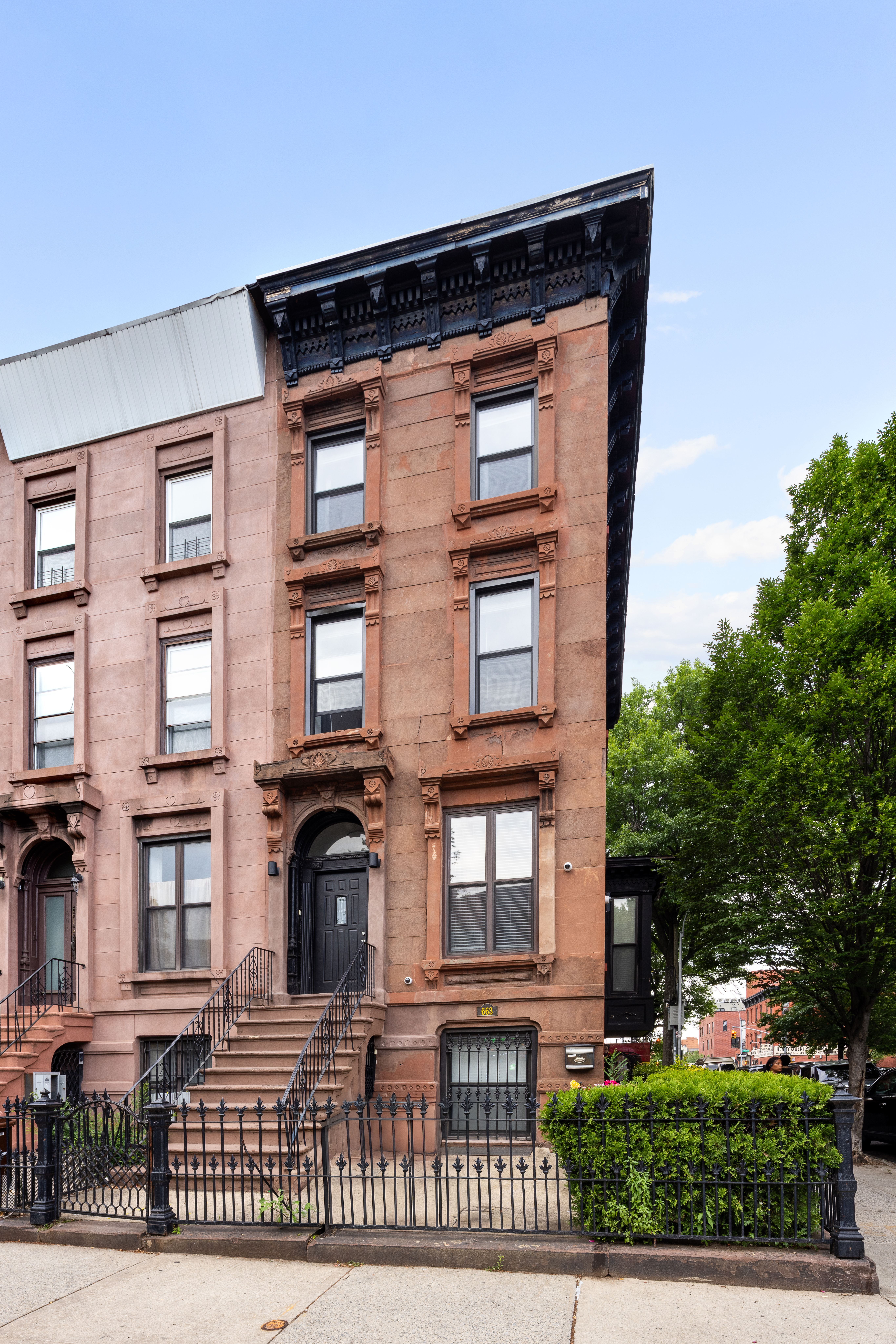663 Greene Avenue Brooklyn, NY 11221 - Photo 11 of 14 a front view of a house with garden