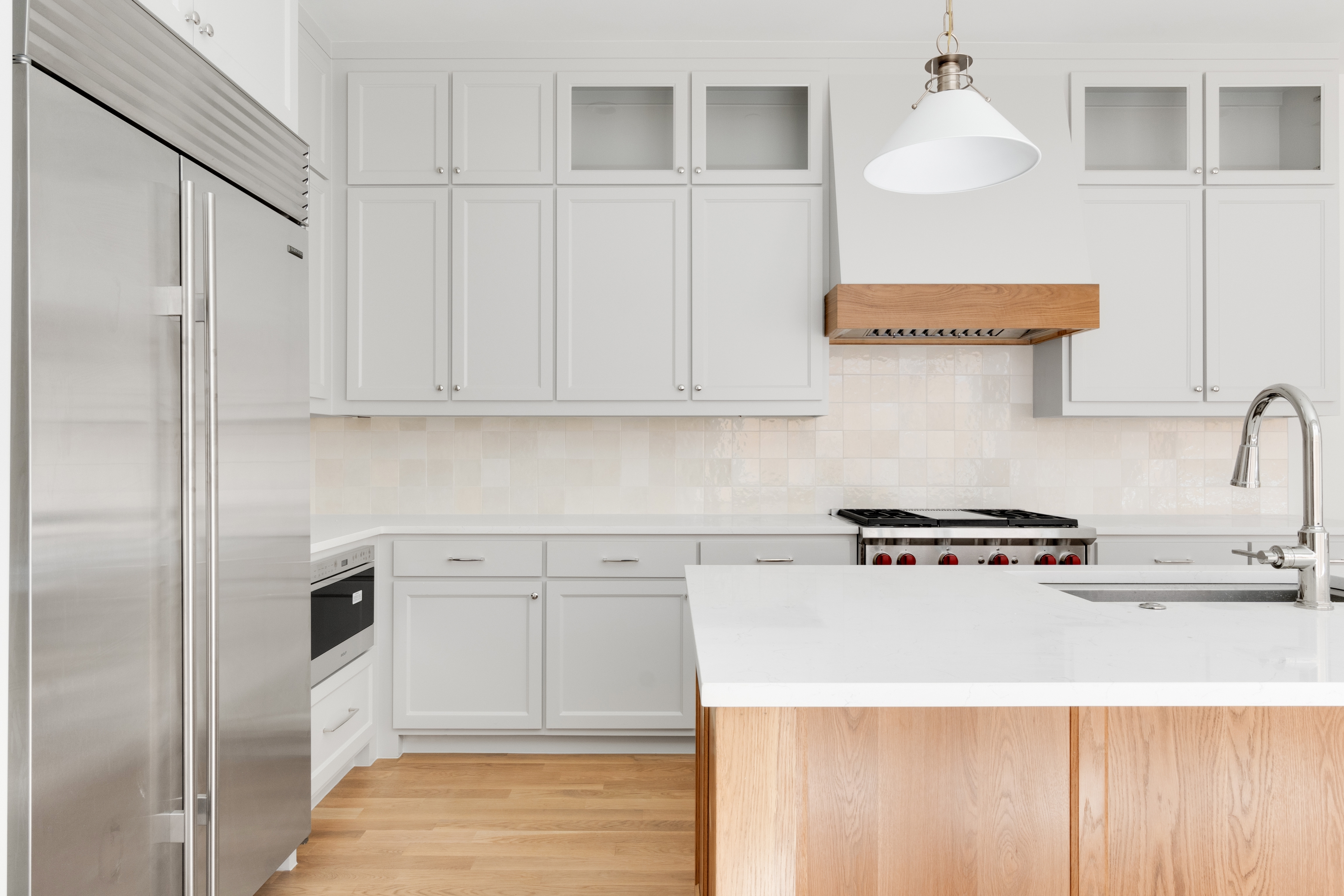 4410 Glenwick Lane Dallas, TX 75205 - Photo 7 of 28 a kitchen with stainless steel appliances granite countertop a sink a stove and a refrigerator with wooden floor
