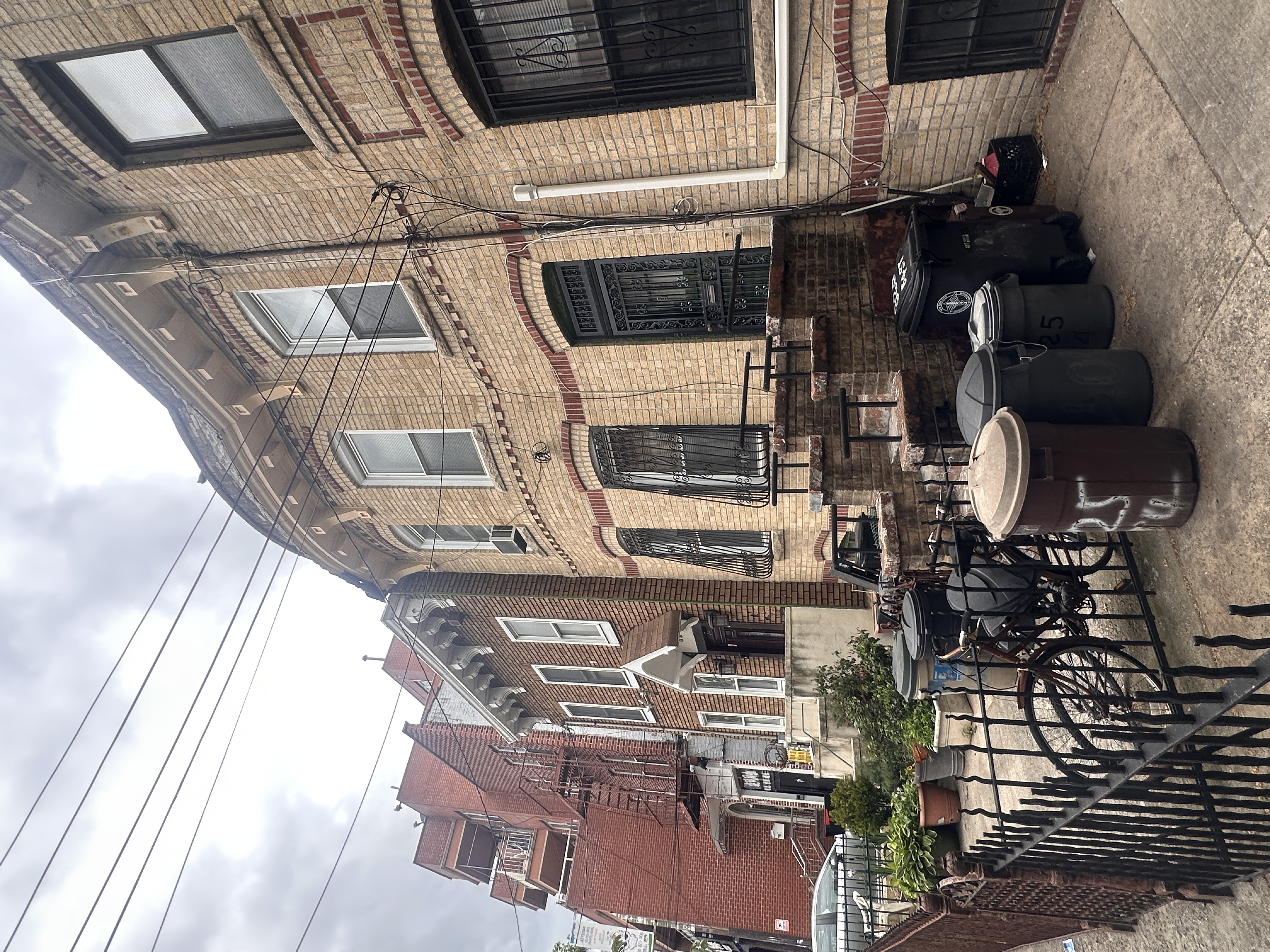 823 54th Street Brooklyn, NY 11220 - Photo 3 of 3 a view of a patio with couches table and chairs