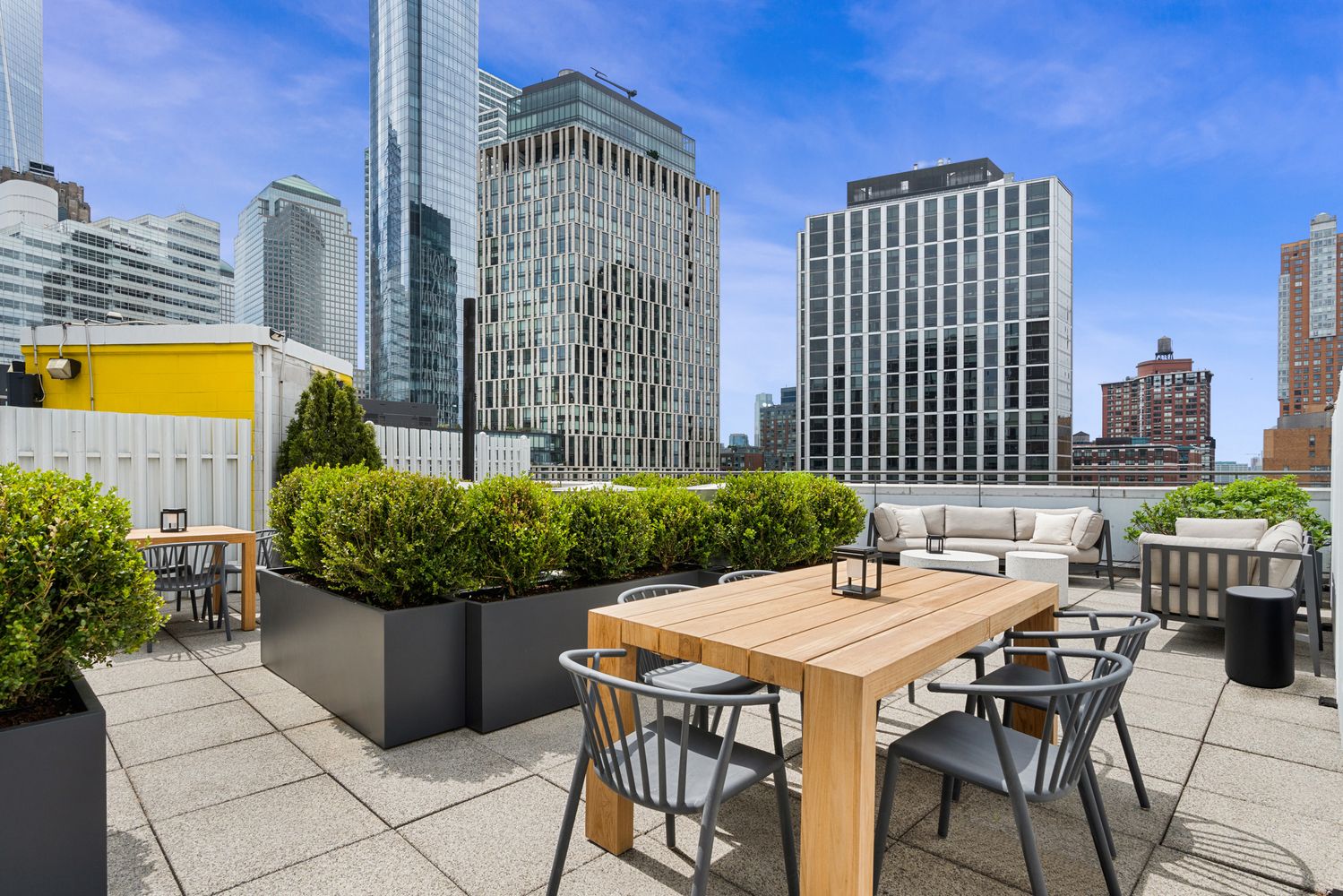 303 Greenwich Street, Unit 8DE Manhattan, NY 10013 - Photo 17 of 20 a view of a patio with a table and chairs