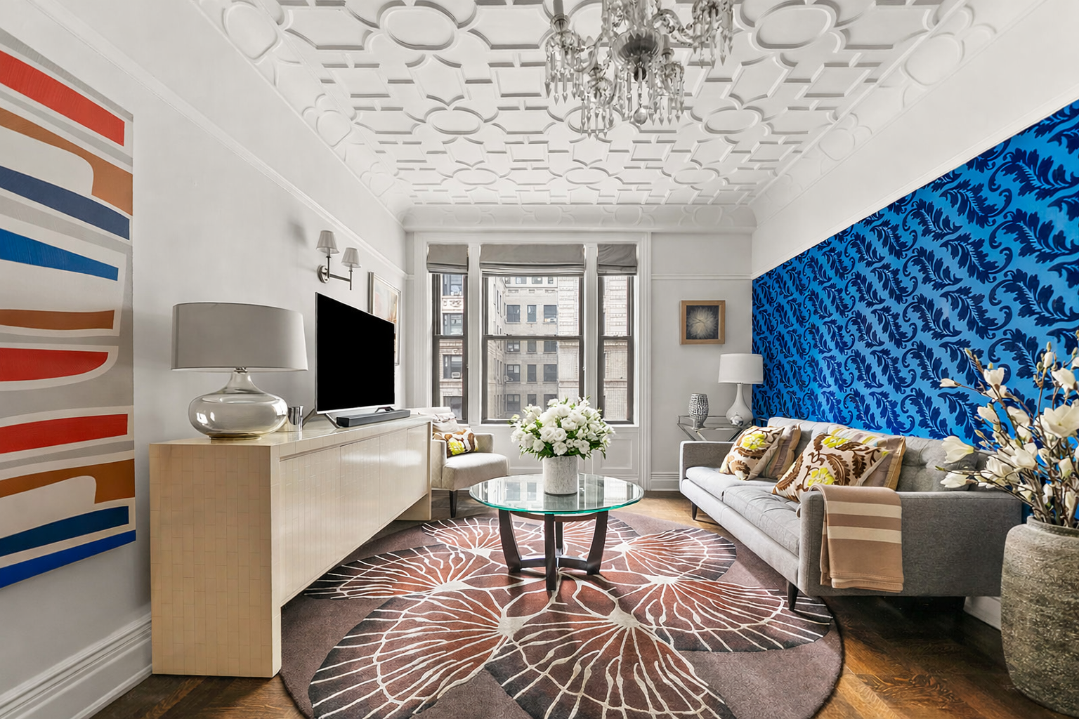 a living room with furniture and a flat screen tv