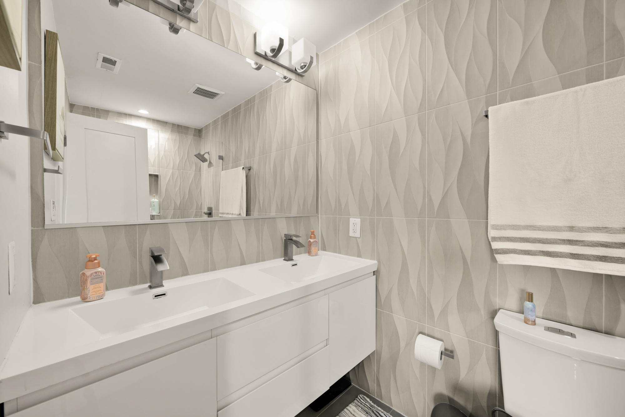 14 T Street Northeast, Unit 1 Washington, DC 20002 - Photo 33 of 39 a bathroom with a sink and a mirror