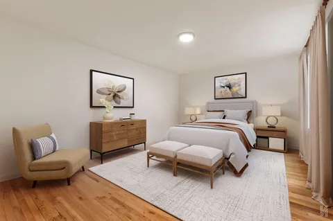 a bedroom with a bed and a couch