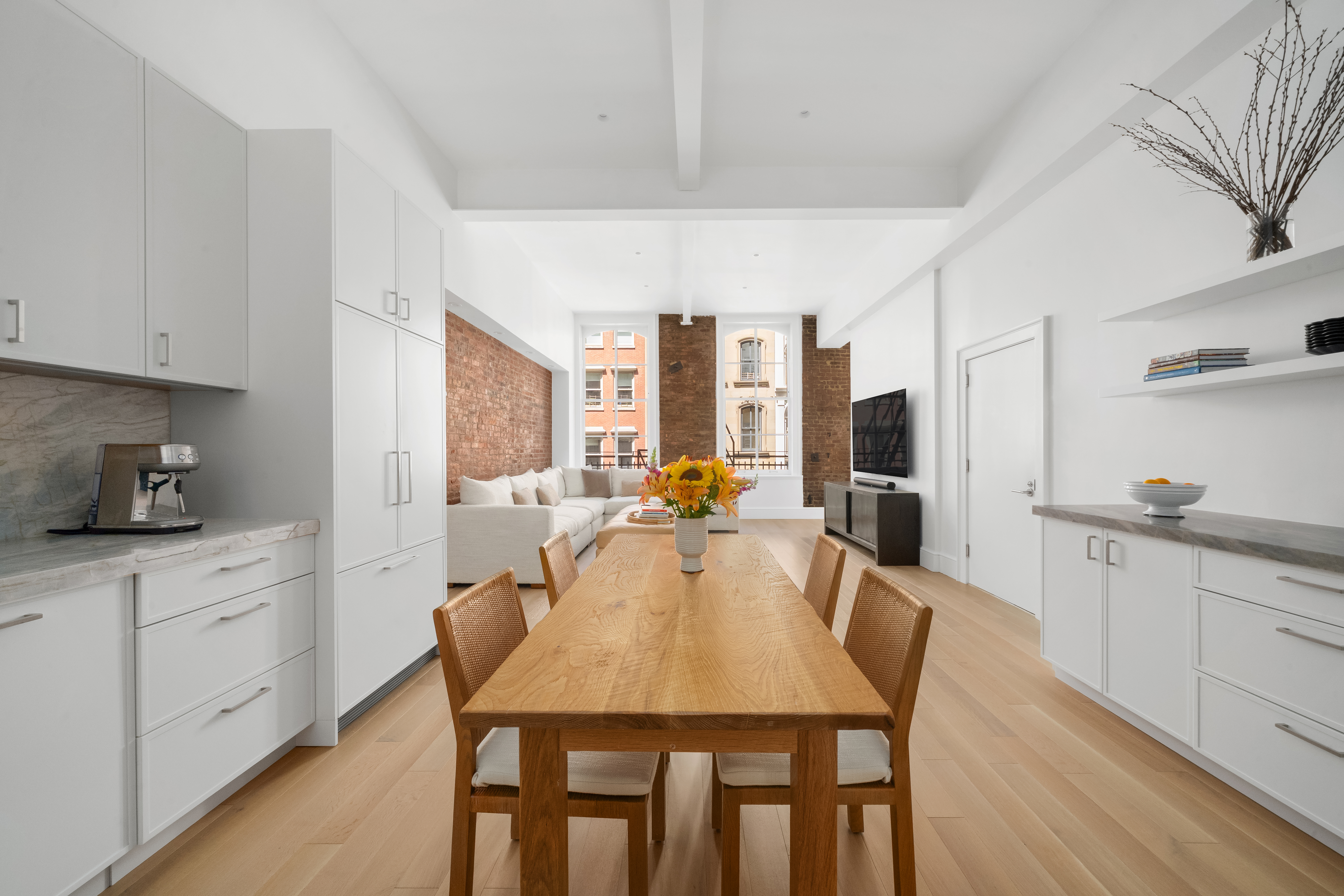 51 Warren Street, Unit 3W Manhattan, NY 10007 - Photo 8 of 13 a view of a dining room with furniture and wooden floor