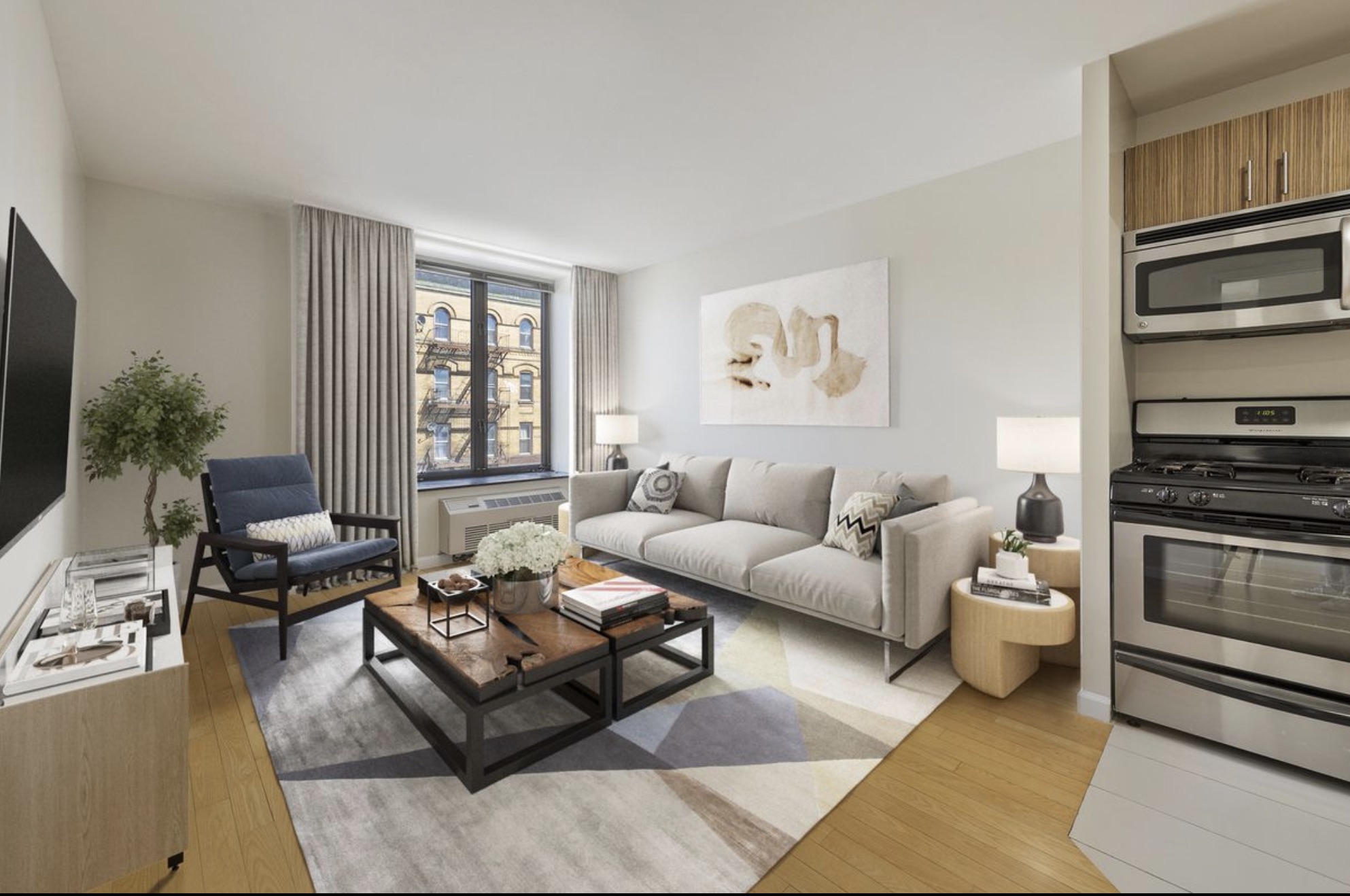 a living room with furniture ceiling fan and a window