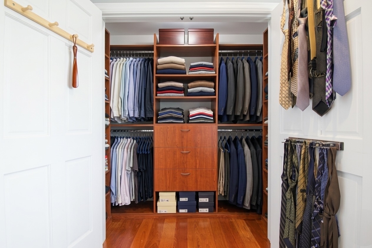 2310 East 66th Street Brooklyn, NY 11234 - Photo 22 of 24 a view of walk in closet with clothes and shoes