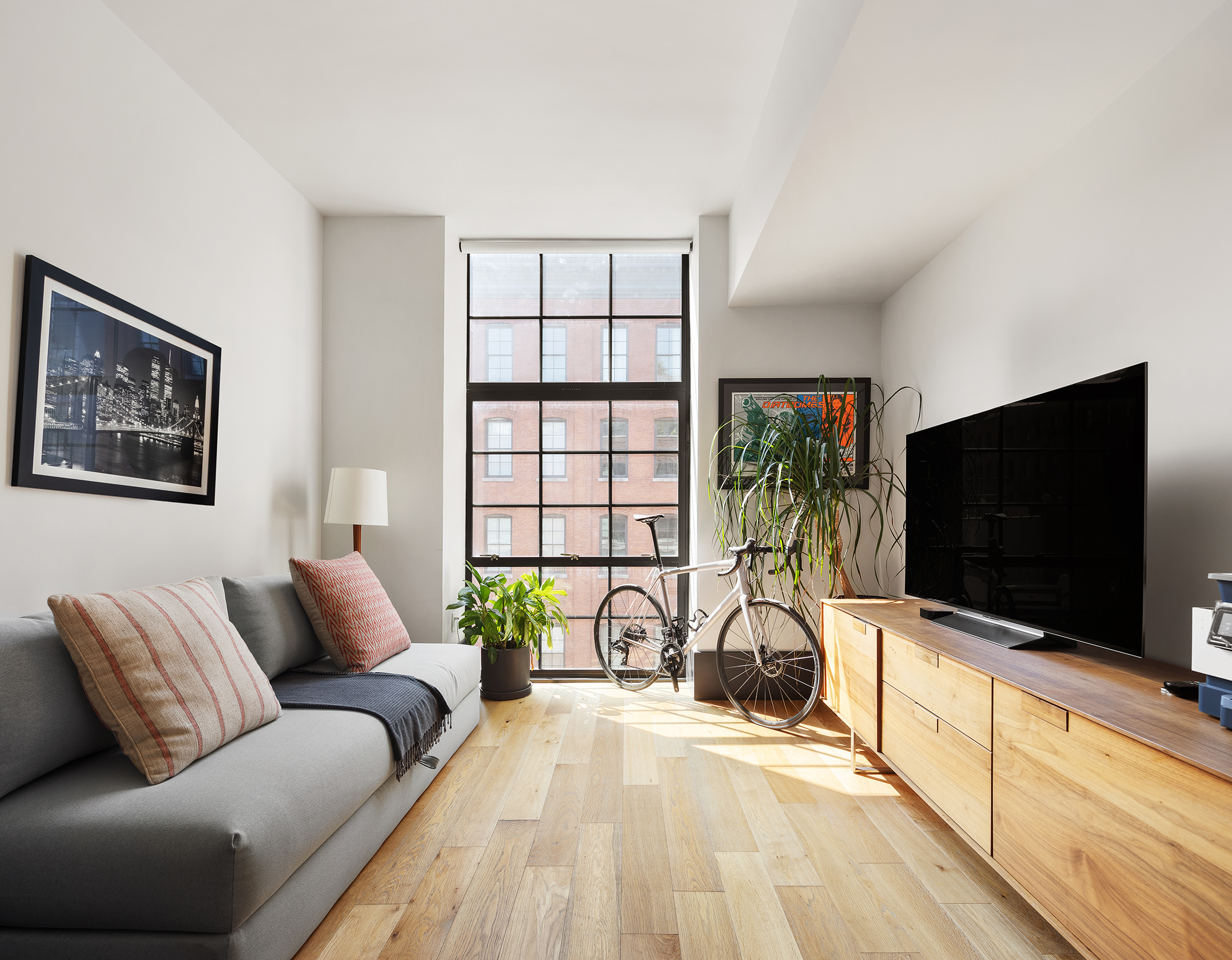 51 Jay Street, Unit 4E Brooklyn, NY 11201 - Photo 7 of 12 a living room with furniture and a flat screen tv