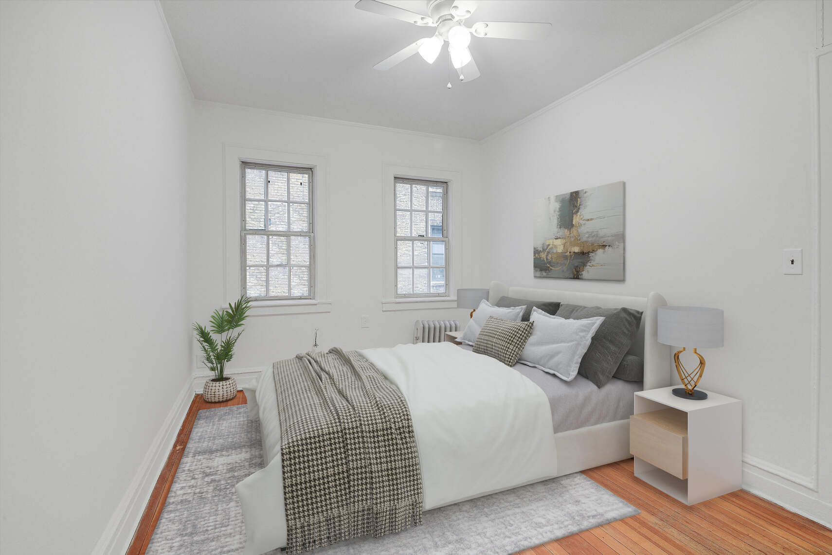 19 Pomander Walk, Unit 1 Manhattan, NY 10025 - Photo 9 of 10 a bedroom with a bed and wooden floor