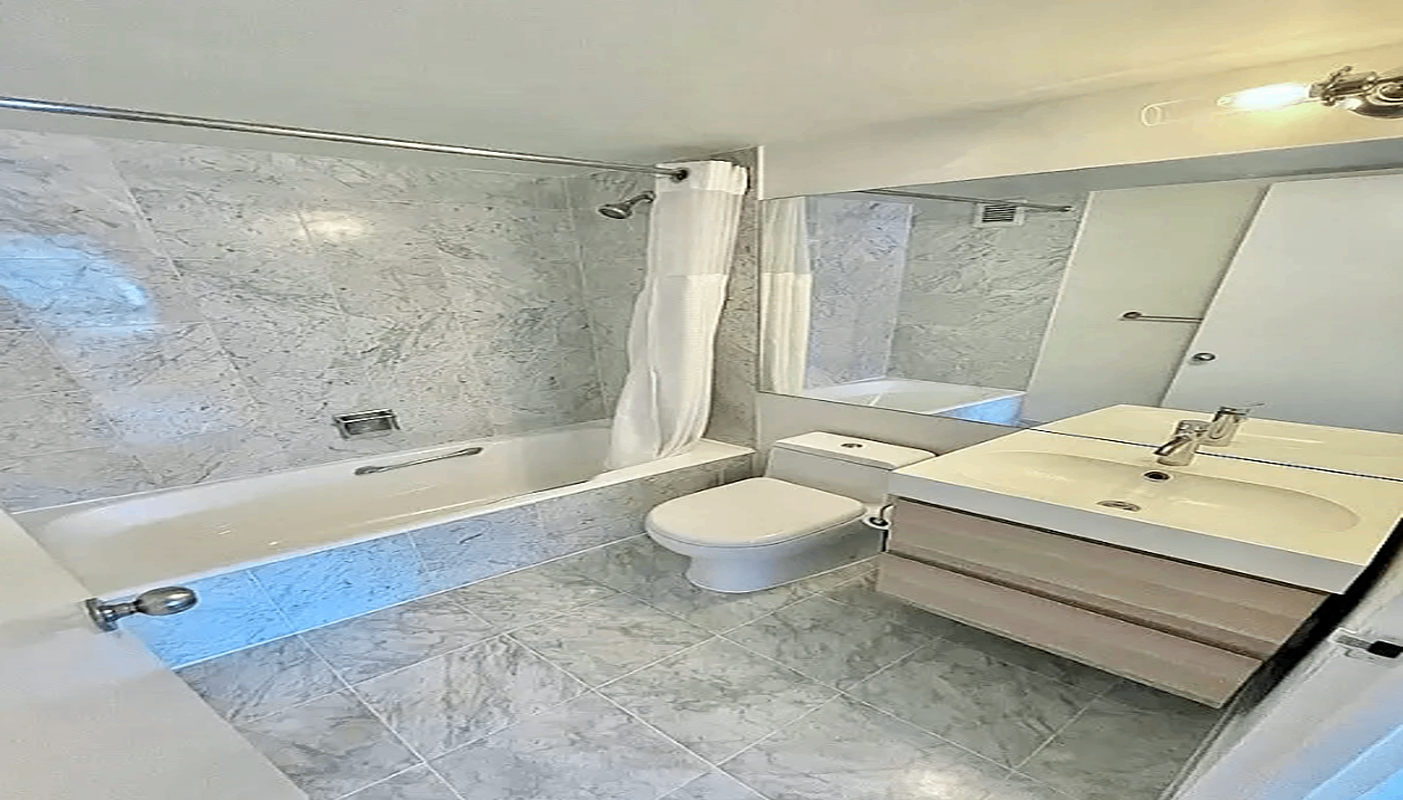 200 Rector Place, Unit 37J Manhattan, NY 10280 - Photo 5 of 12 a bathroom with a sink toilet bathtub and shower