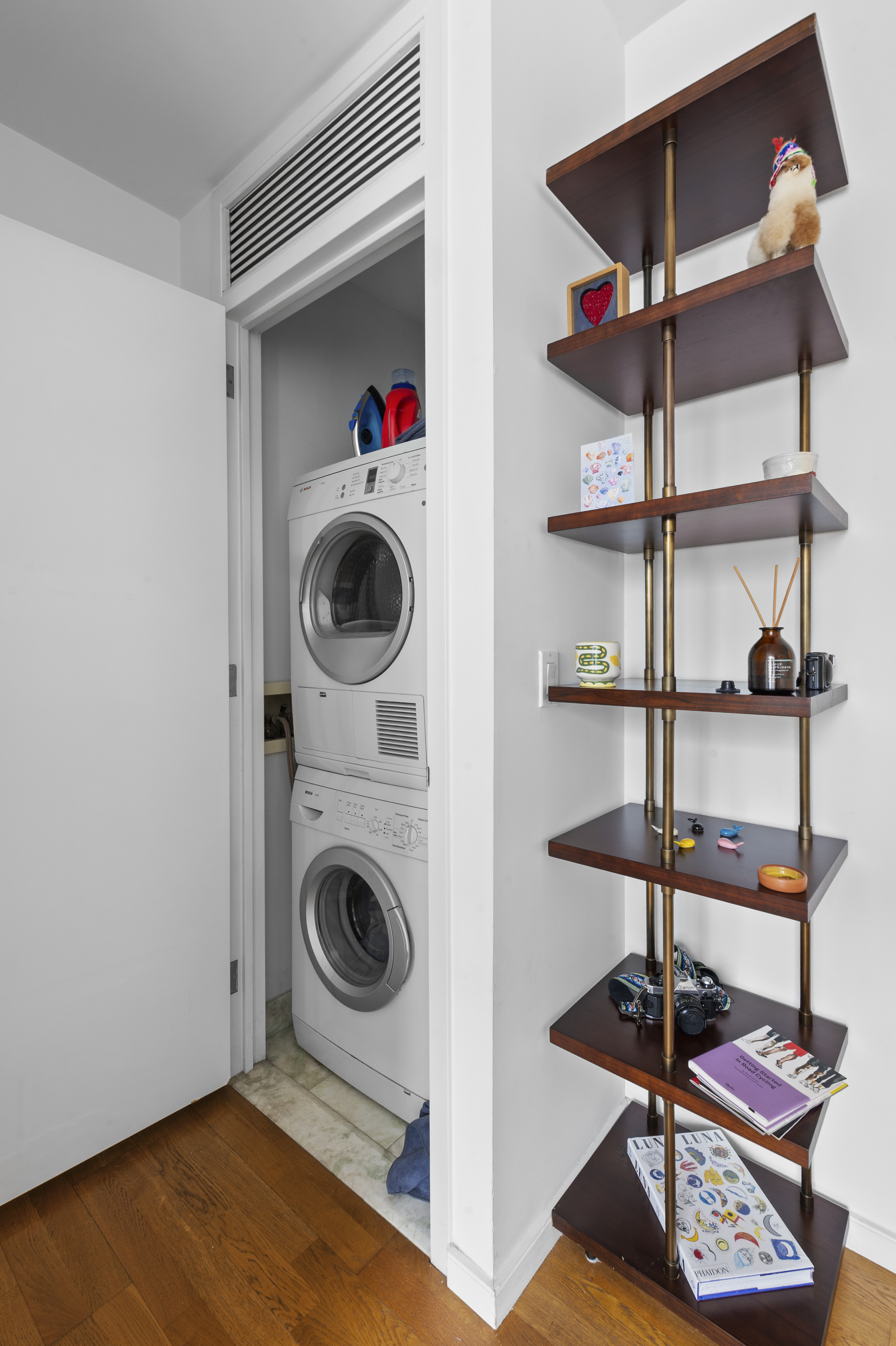 635 West 42nd Street, Unit 14K Manhattan, NY 10036 - Photo 8 of 19 a utility room with dryer and washer