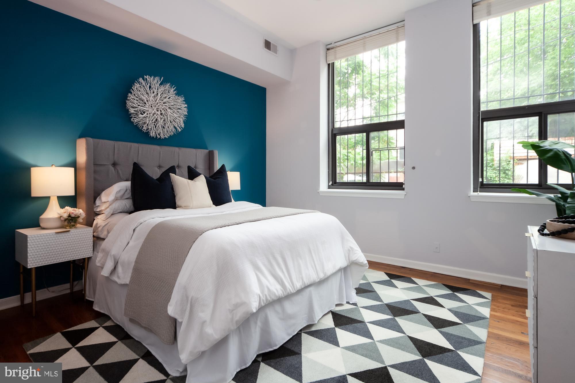 1715 15th Street Northwest, Unit 101 Washington, DC 20009 - Photo 6 of 23 a bedroom with a bed and a window