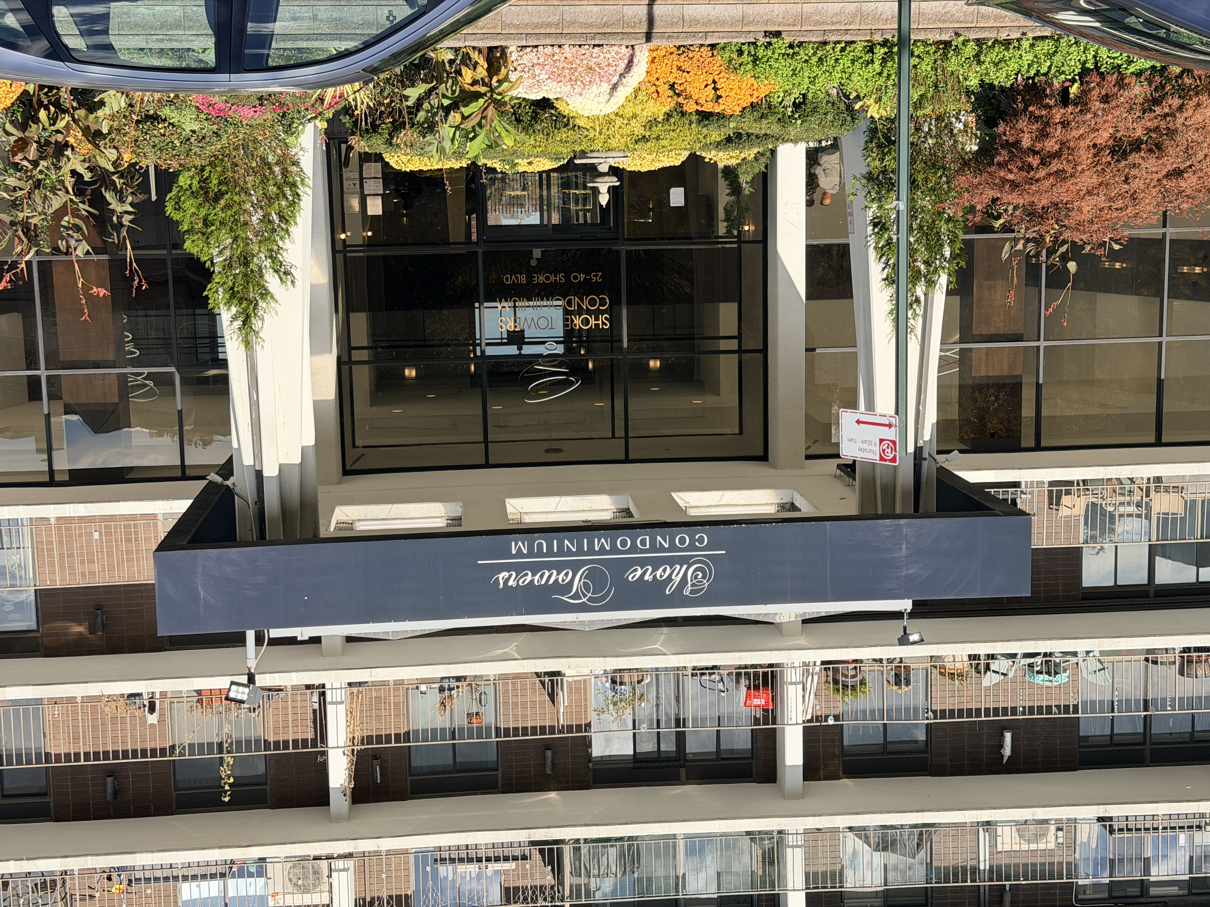 2540 Shore Boulevard, Unit 4S Queens, NY 11102 - Photo 19 of 31 a front view of a building with street view