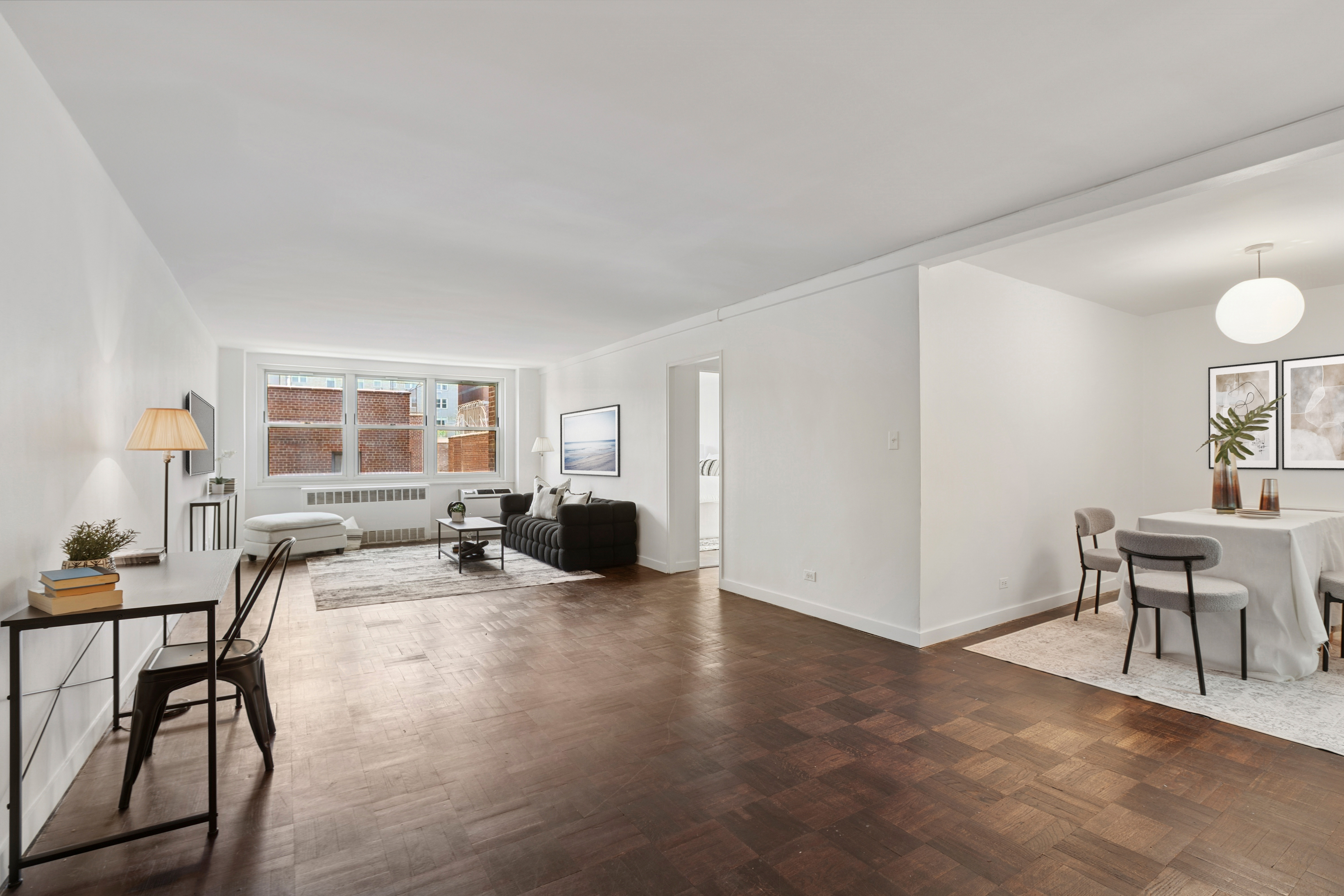 315 East 70th Street, Unit 7D Manhattan, NY 10021 - Photo 3 of 16 a view of a livingroom with furniture and a window