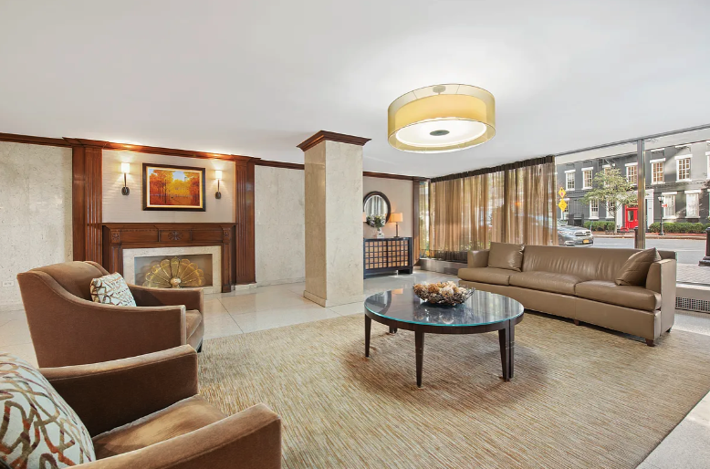 530 East 72nd Street, Unit 4F Manhattan, NY 10021 - Photo 16 of 23 a living room with fireplace furniture and a large window