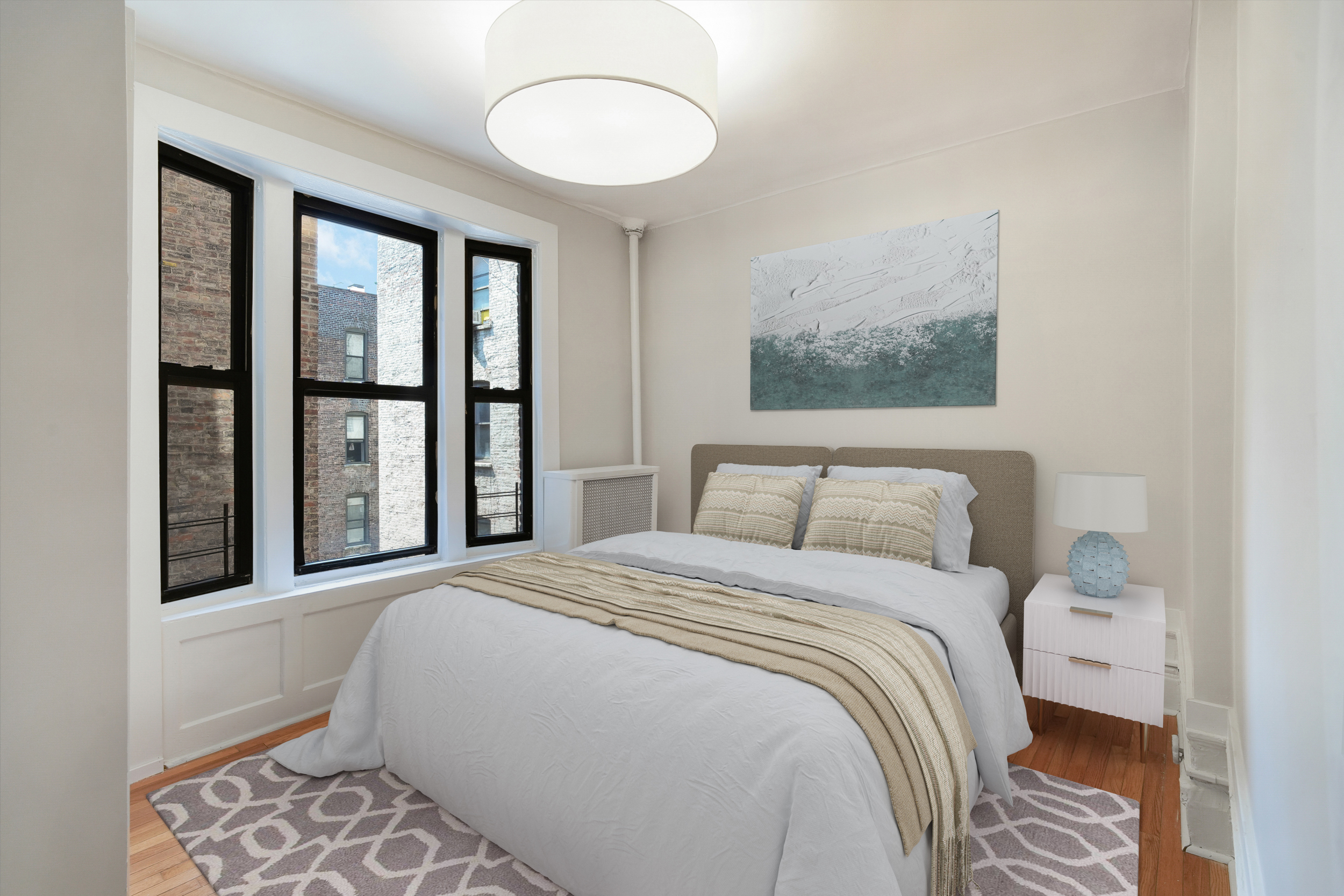 200 West 109th Street, Unit C1 Manhattan, NY 10025 - Photo 5 of 16 a bedroom with a large bed and a window