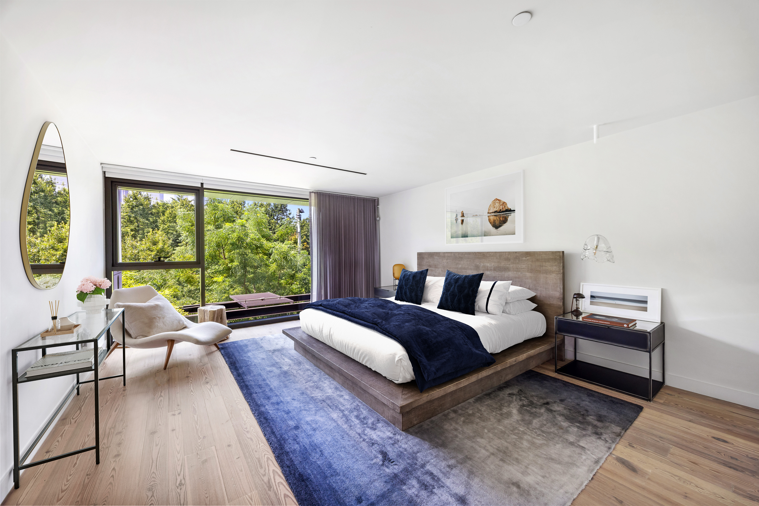 90 Furman Street, Unit N208 Brooklyn, NY 11201 - Photo 7 of 23 a spacious bedroom with a bed and a large window