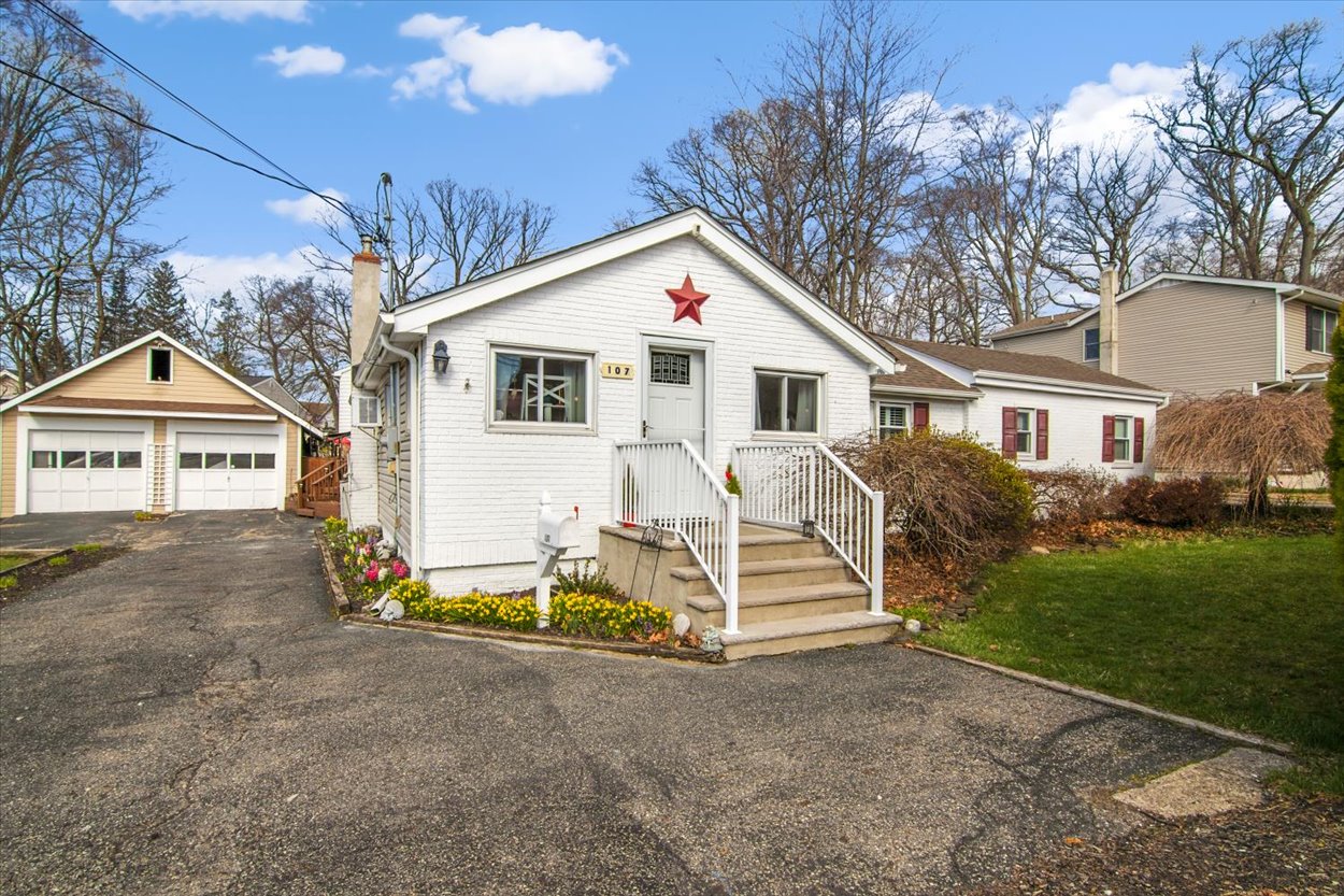 107 Kingston Road Parsippany, NJ 07054 - Photo 38 of 43 a view of a house with a yard and large tree