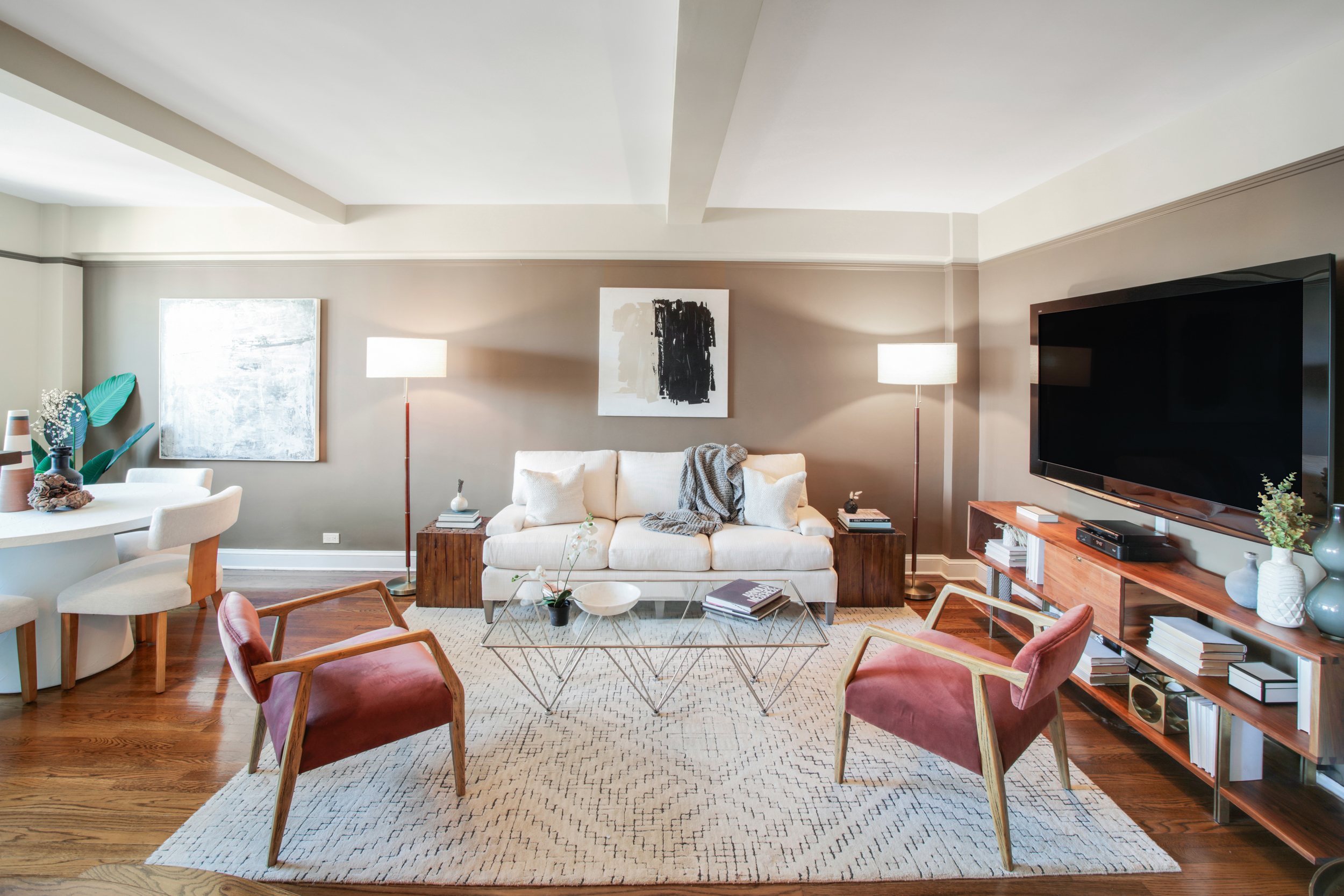 200 West 20th Street, Unit 1409/10 Manhattan, NY 10011 - Photo 3 of 15 a living room with furniture and a flat screen tv