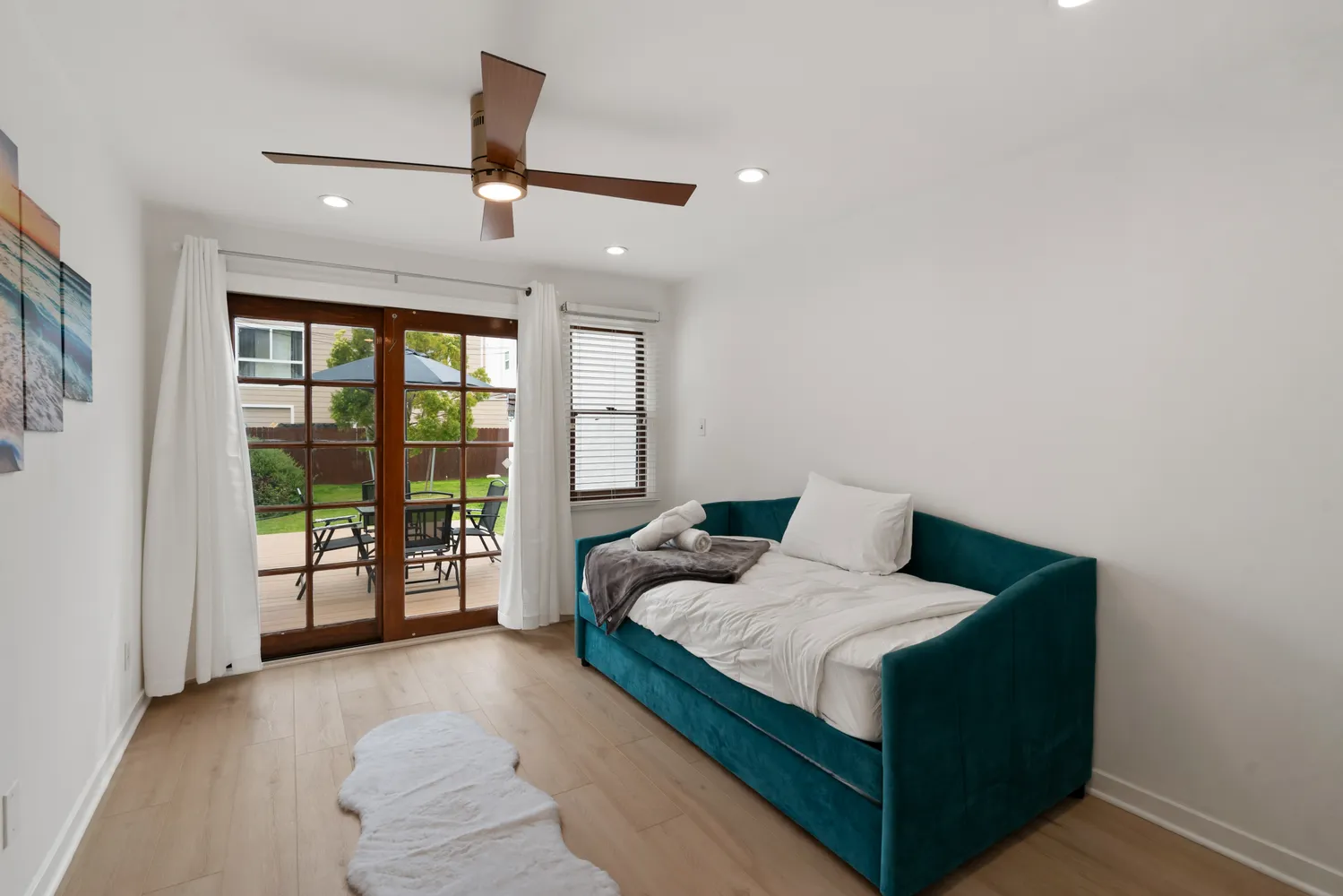 a living room with furniture and large windows