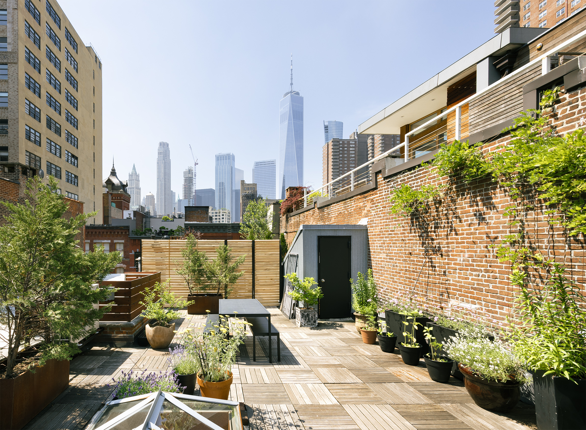 184 Franklin Street, Unit 10 Manhattan, NY 10013 - Photo 1 of 8 a view of a city with tall buildings