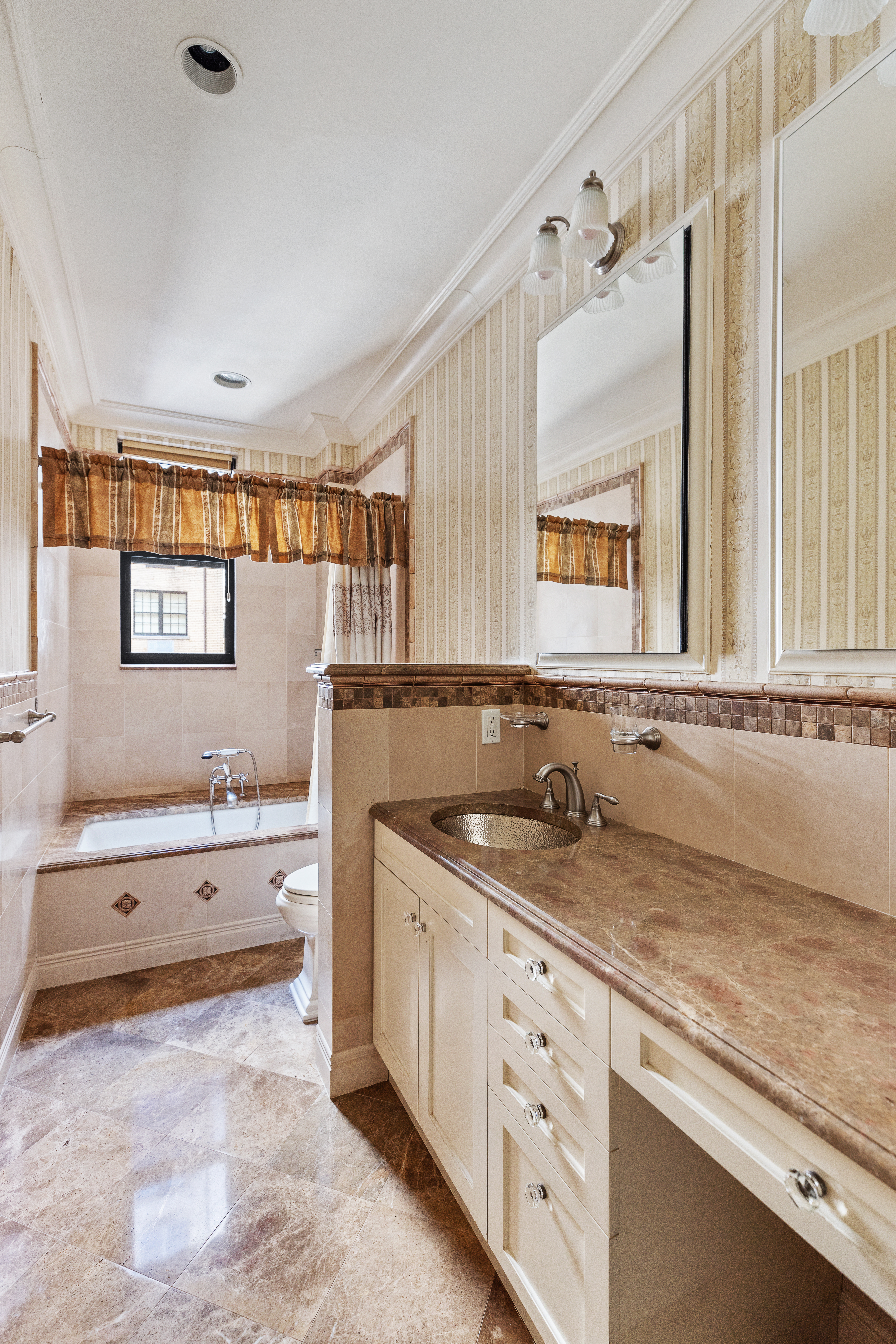 1160 Park Avenue, Unit 8C Manhattan, NY 10128 - Photo 9 of 18 a bathroom with a granite countertop sink mirror and a