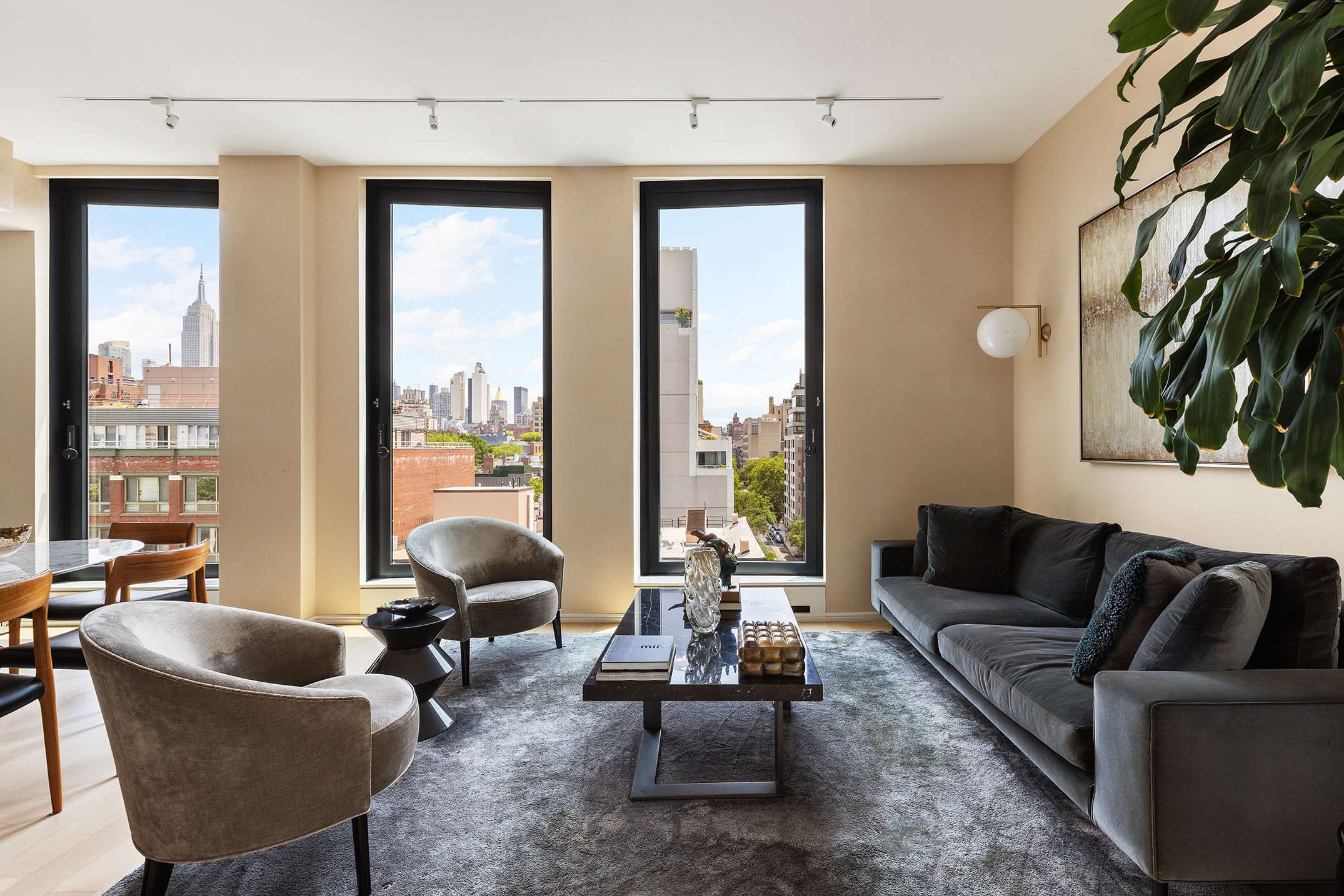 505 West 19th Street, Unit 7B Manhattan, NY 10011 - Photo 8 of 16 a living room with furniture and a large window