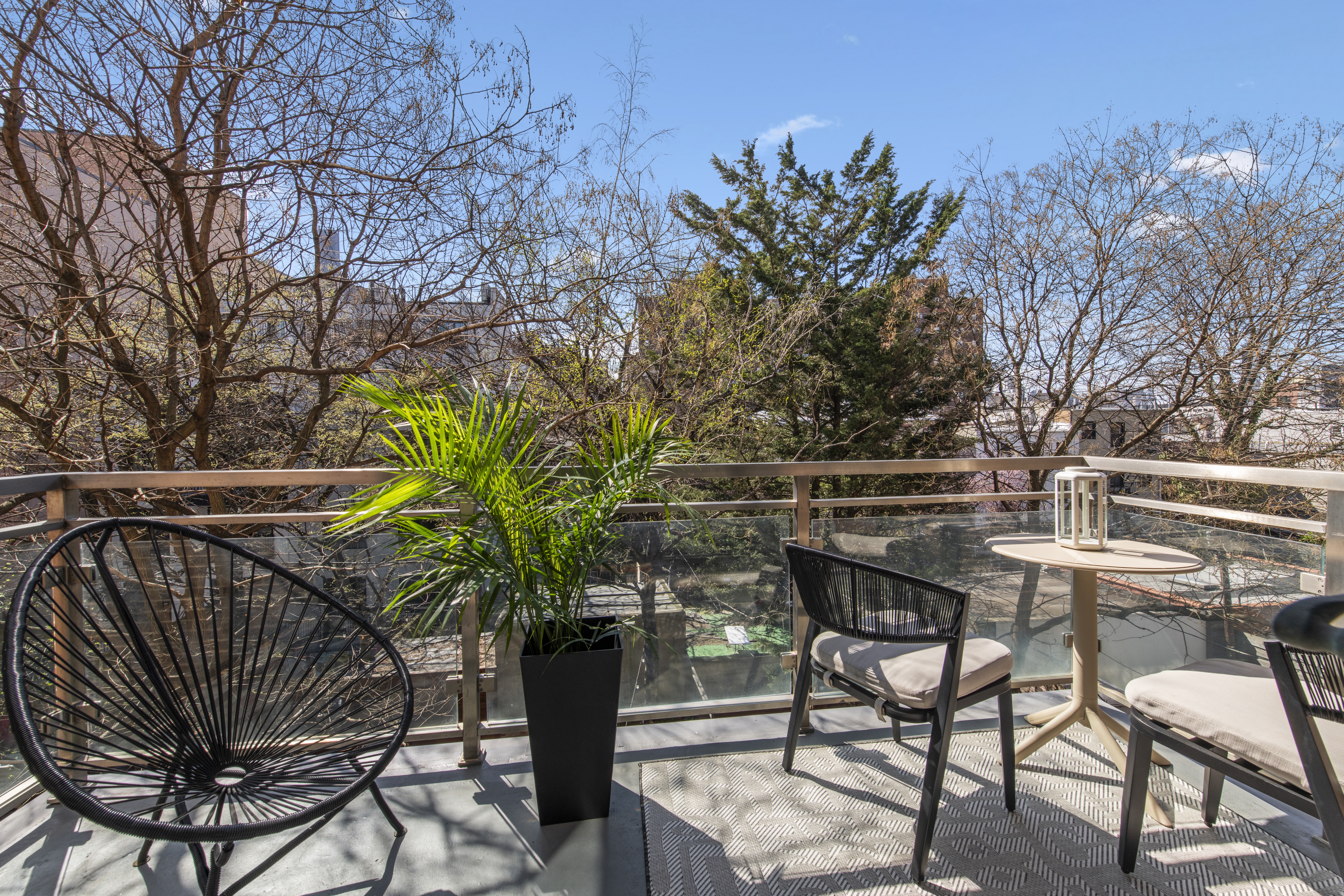 82 Adelphi Street, Unit 3D Brooklyn, NY 11205 - Photo 5 of 7 a view of chairs and couch in the balcony