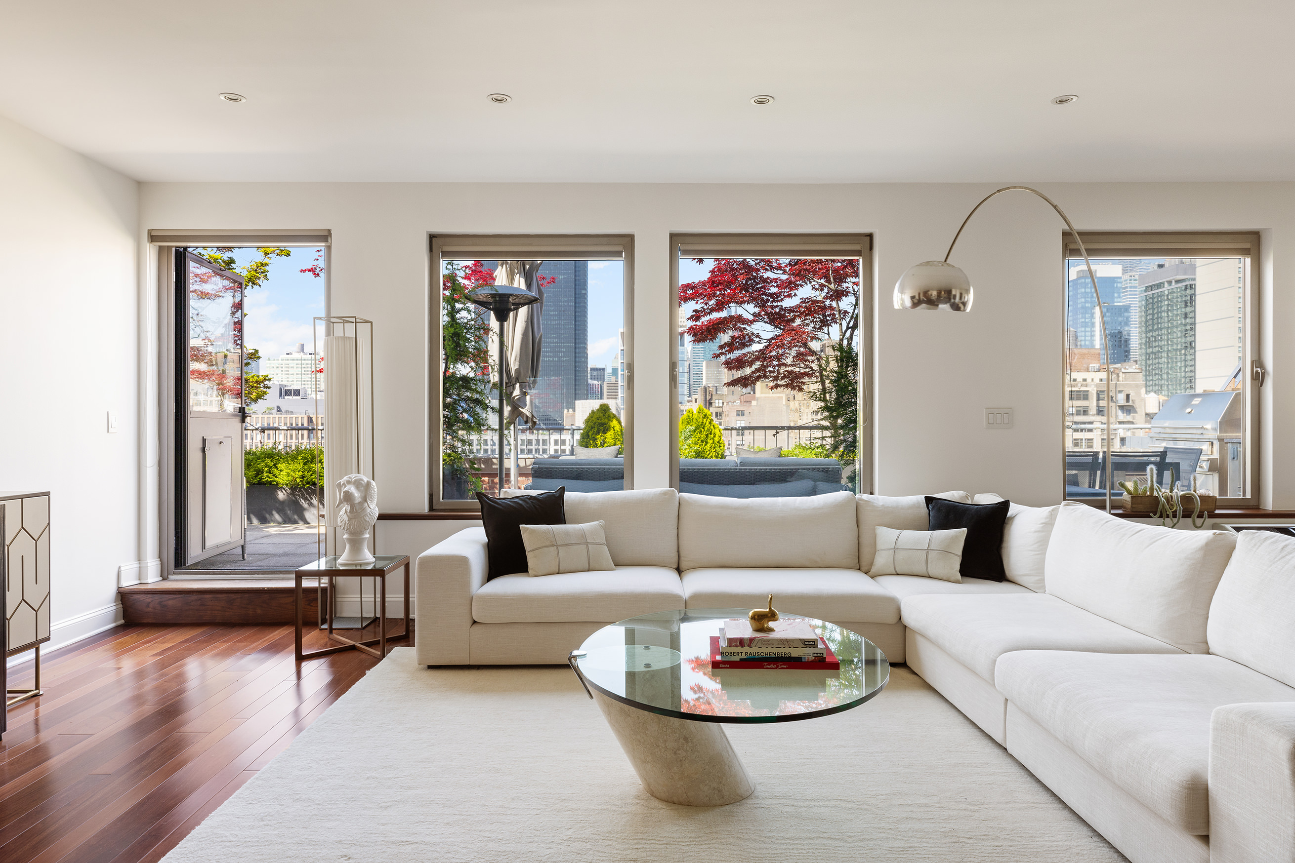 252 7th Avenue, Unit PHG Manhattan, NY 10001 - Photo 3 of 27 a living room with furniture and a large window