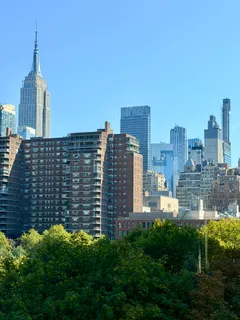 a view of a city with tall buildings