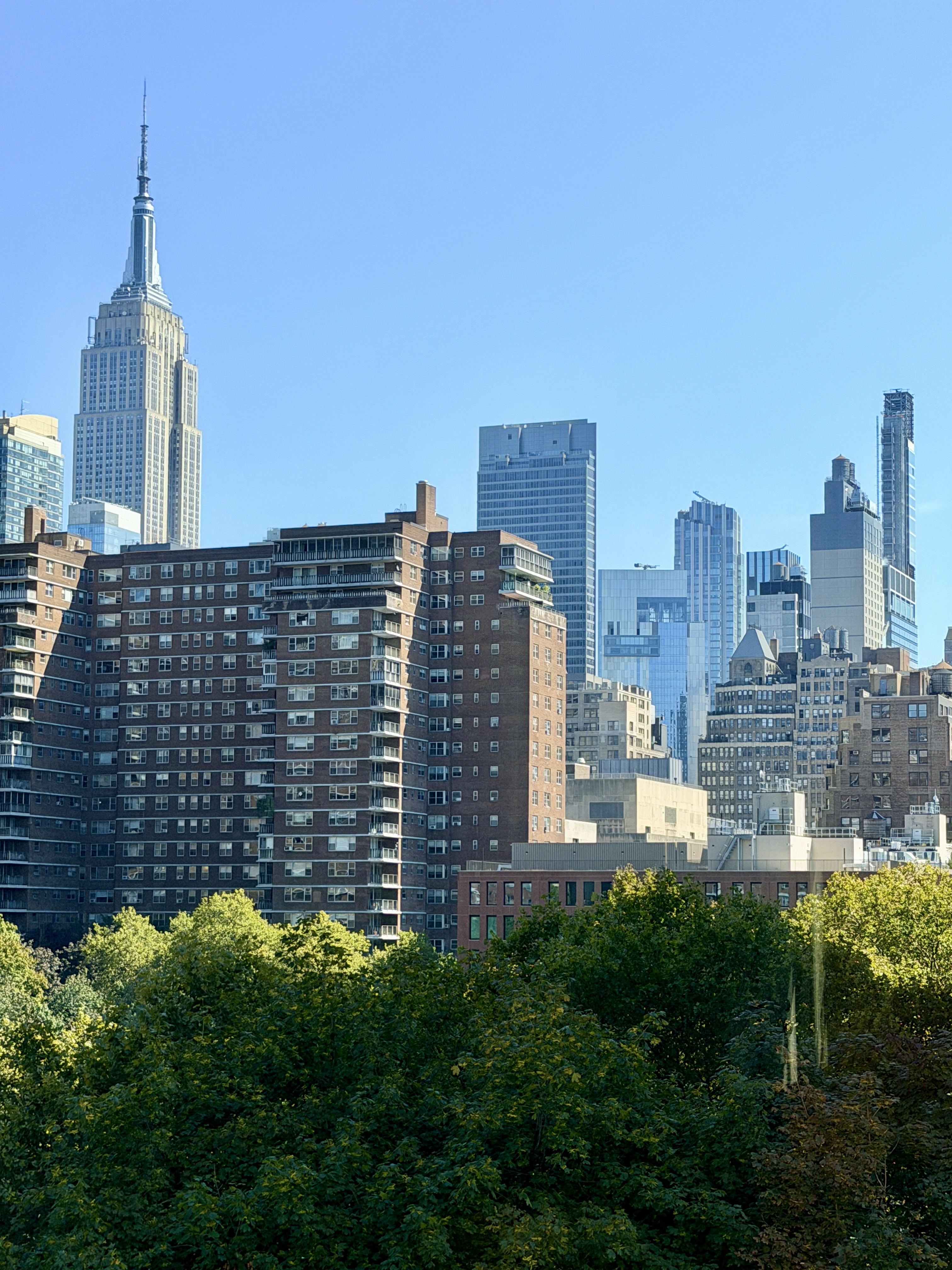 263 9th Avenue, Unit 5B Manhattan, NY 10001 - Photo 3 of 14 a view of a city with tall buildings