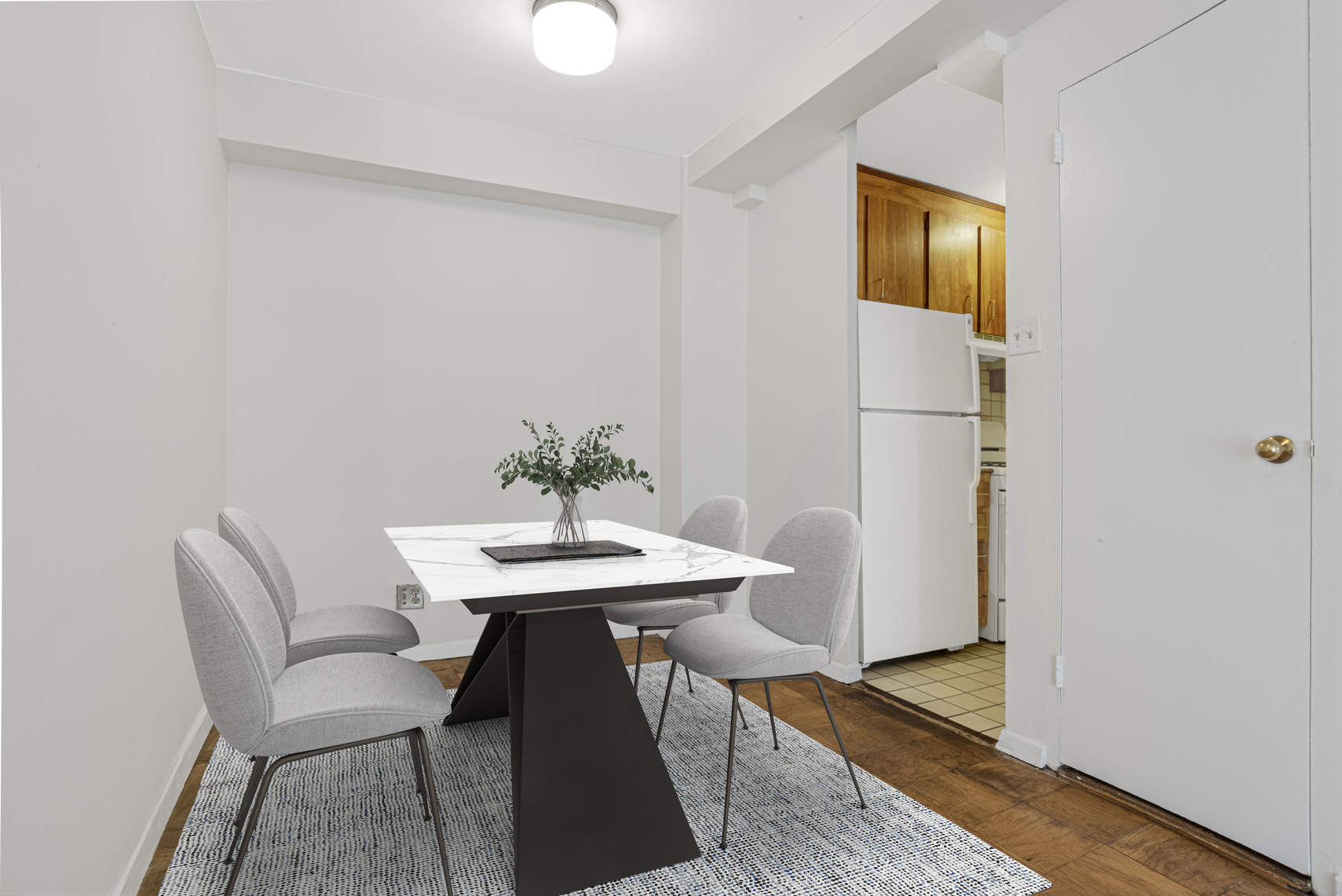 515 East 85th Street, Unit 8C Manhattan, NY 10028 - Photo 7 of 10 a dining room with furniture and wooden floor