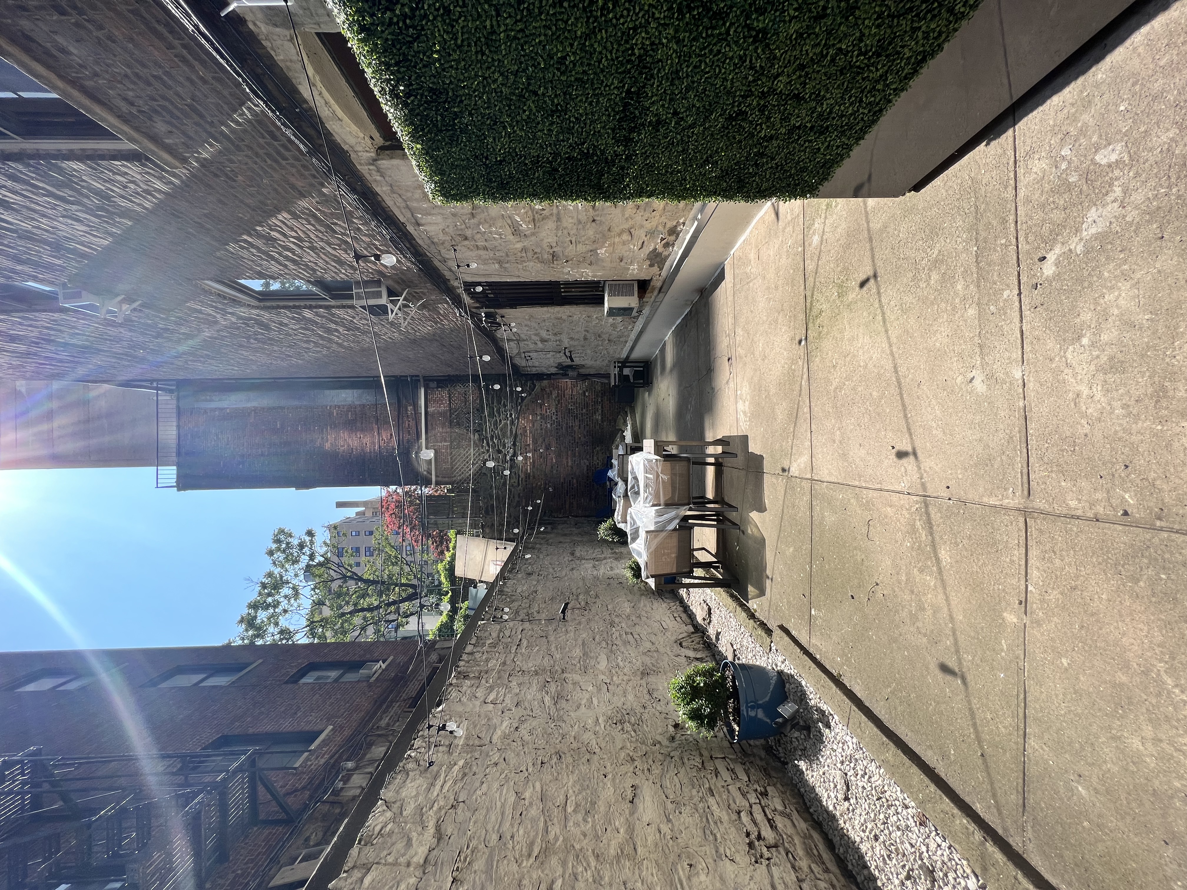 345 West 70th Street, Unit 5F Manhattan, NY 10023 - Photo 11 of 13 a building outdoor space with patio furniture and potted plants