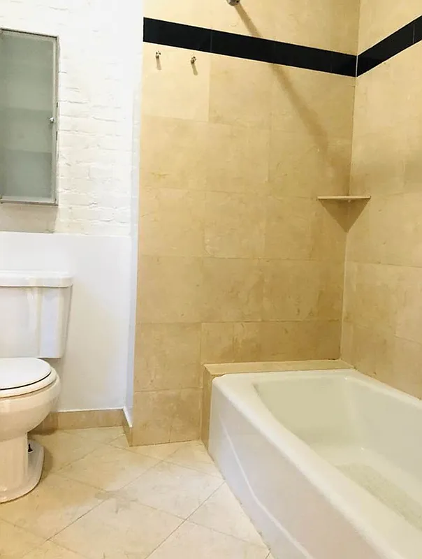 112 West 15th Street, Unit 2 Manhattan, NY 10011 - Photo 8 of 13 a bathroom with a bathtub and a shower