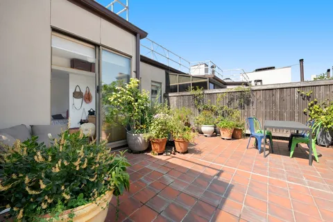 a view of a chairs and table in a patio