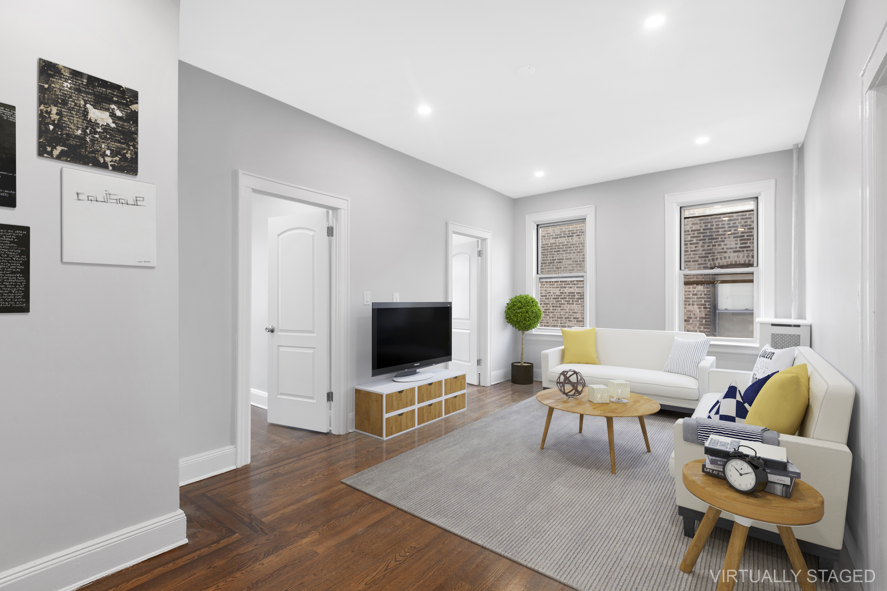 45-15 41st Street, Unit 3R Queens, NY 11104 - Photo 1 of 7 a living room with furniture a window and a flat screen tv