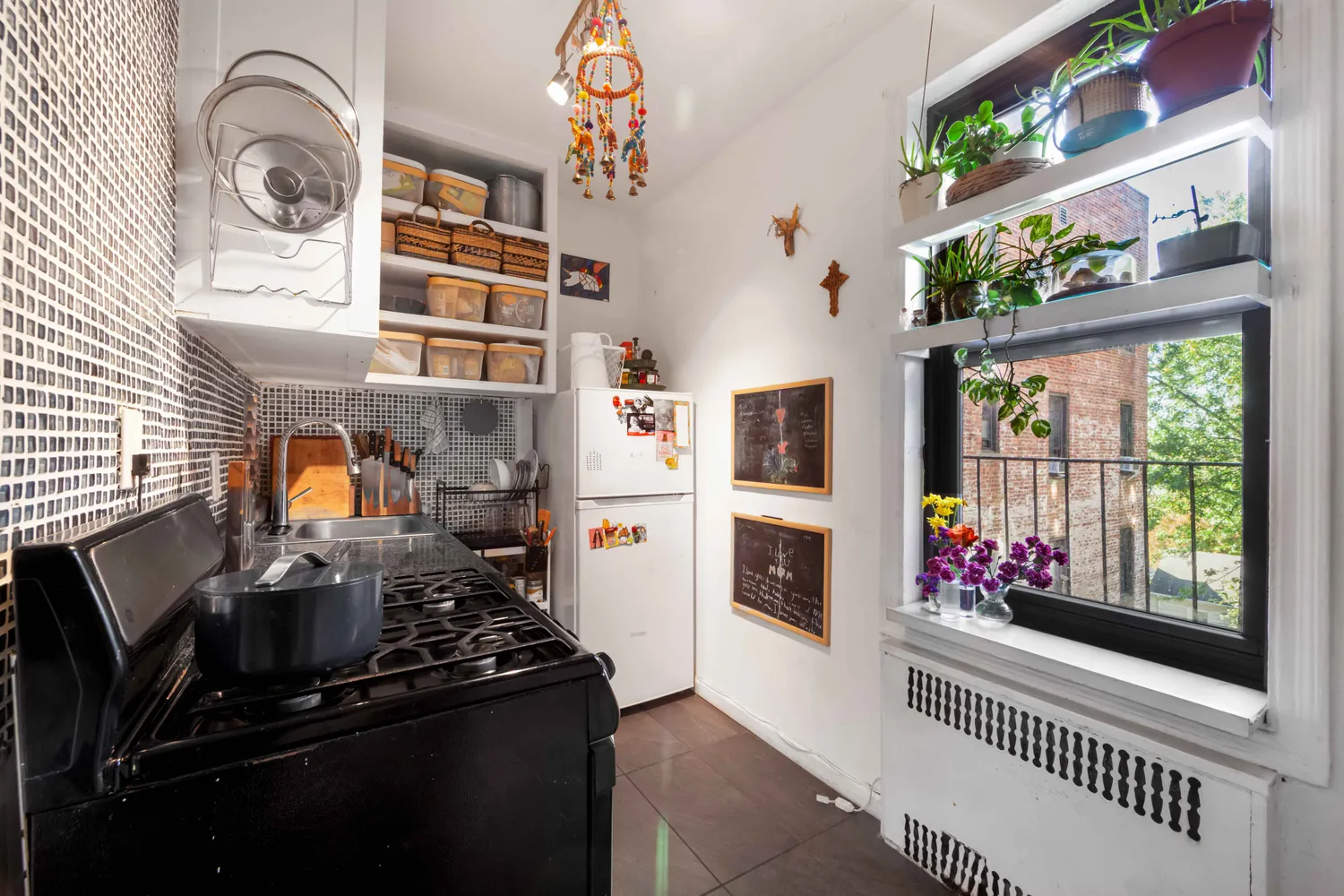a kitchen with stainless steel appliances granite countertop a stove and a window