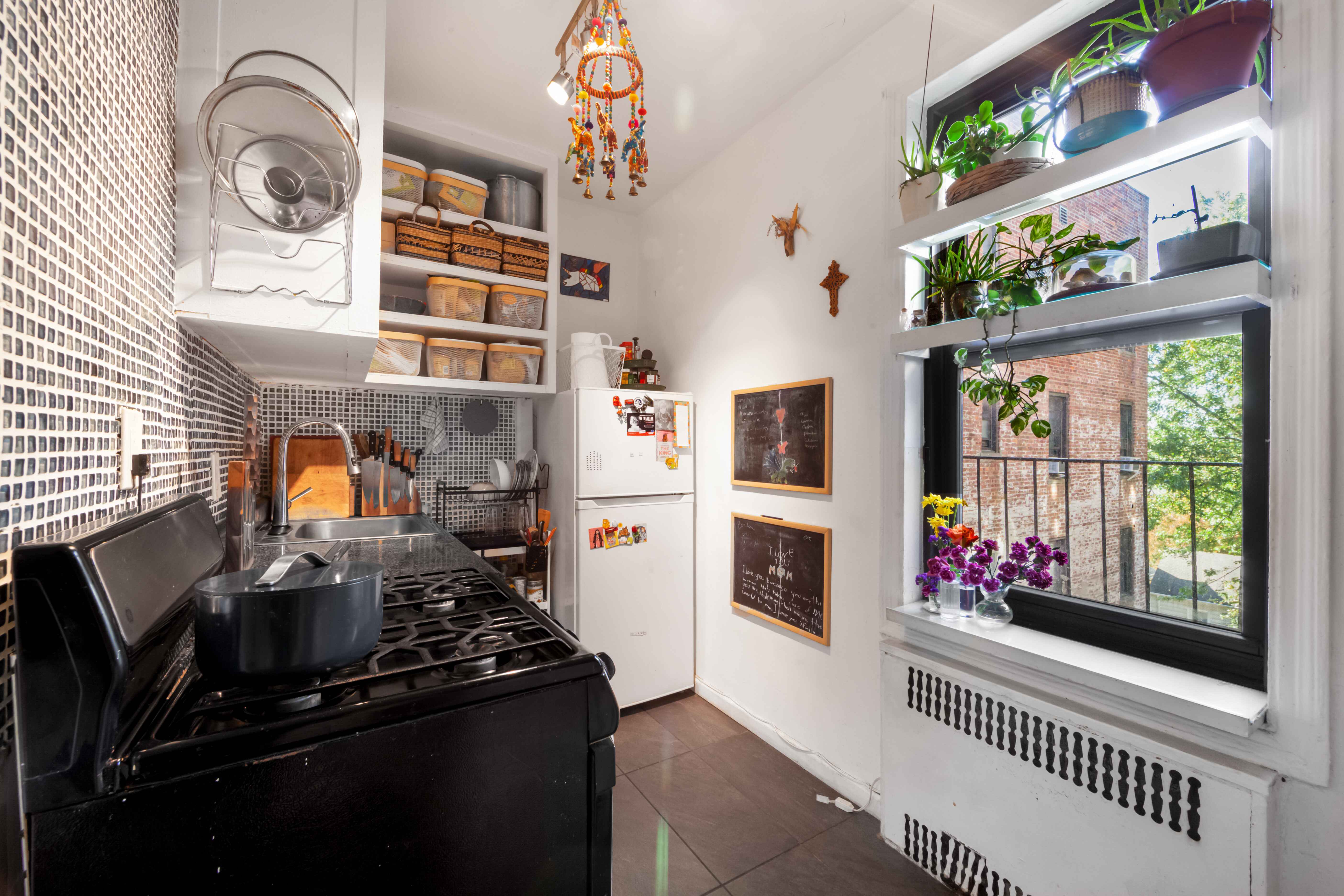 260 Ocean Parkway, Unit 5G Brooklyn, NY 11218 - Photo 7 of 10 a kitchen with stainless steel appliances granite countertop a stove and a window