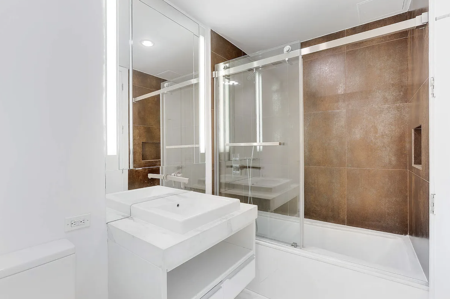 133 West 22nd Street, Unit 7H Manhattan, NY 10011 - Photo 13 of 22 a bathroom with a shower and a sink