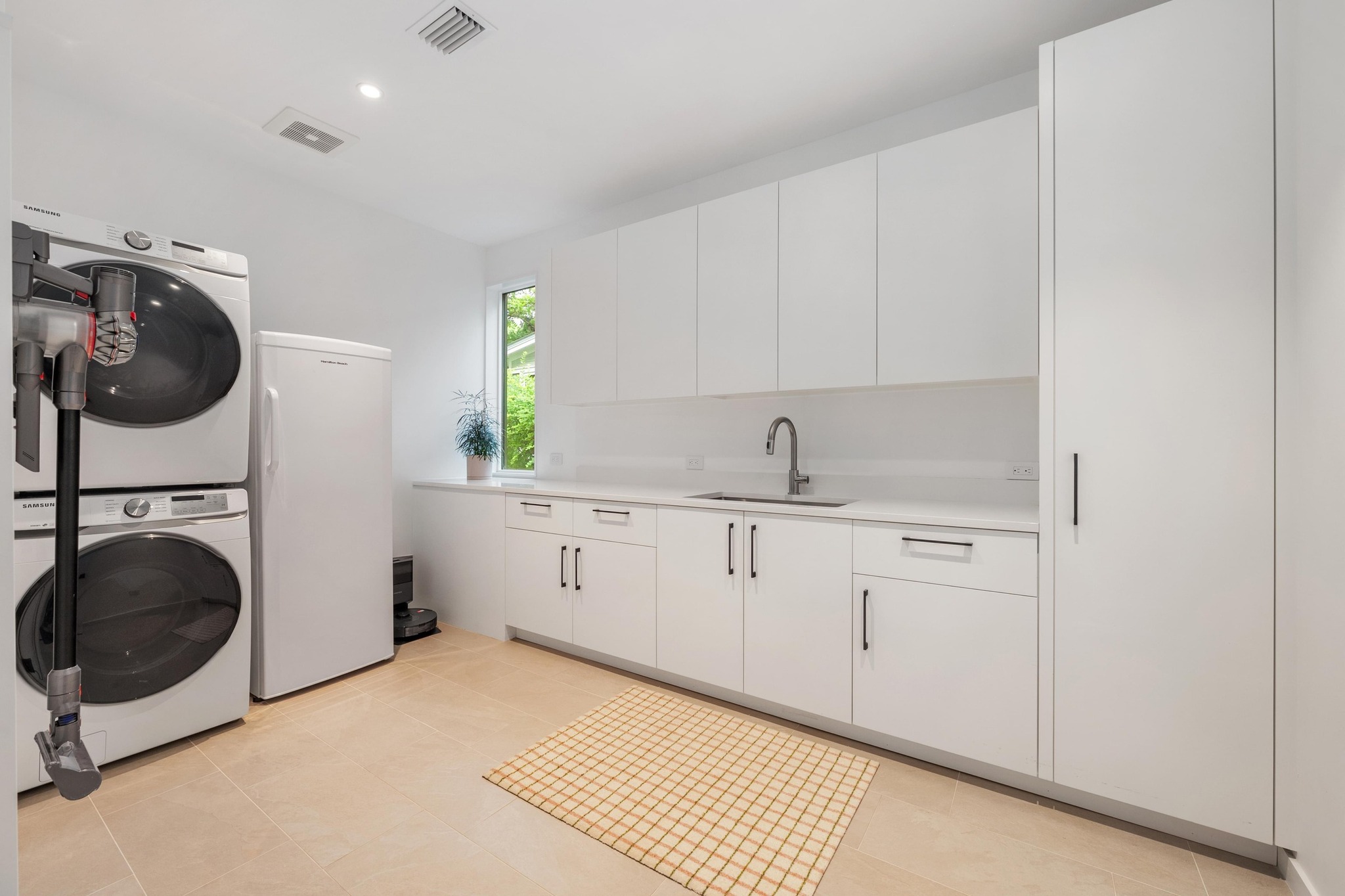 1206 Bickler Road Austin, TX 78704 - Photo 53 of 65 a kitchen with a sink cabinets and window