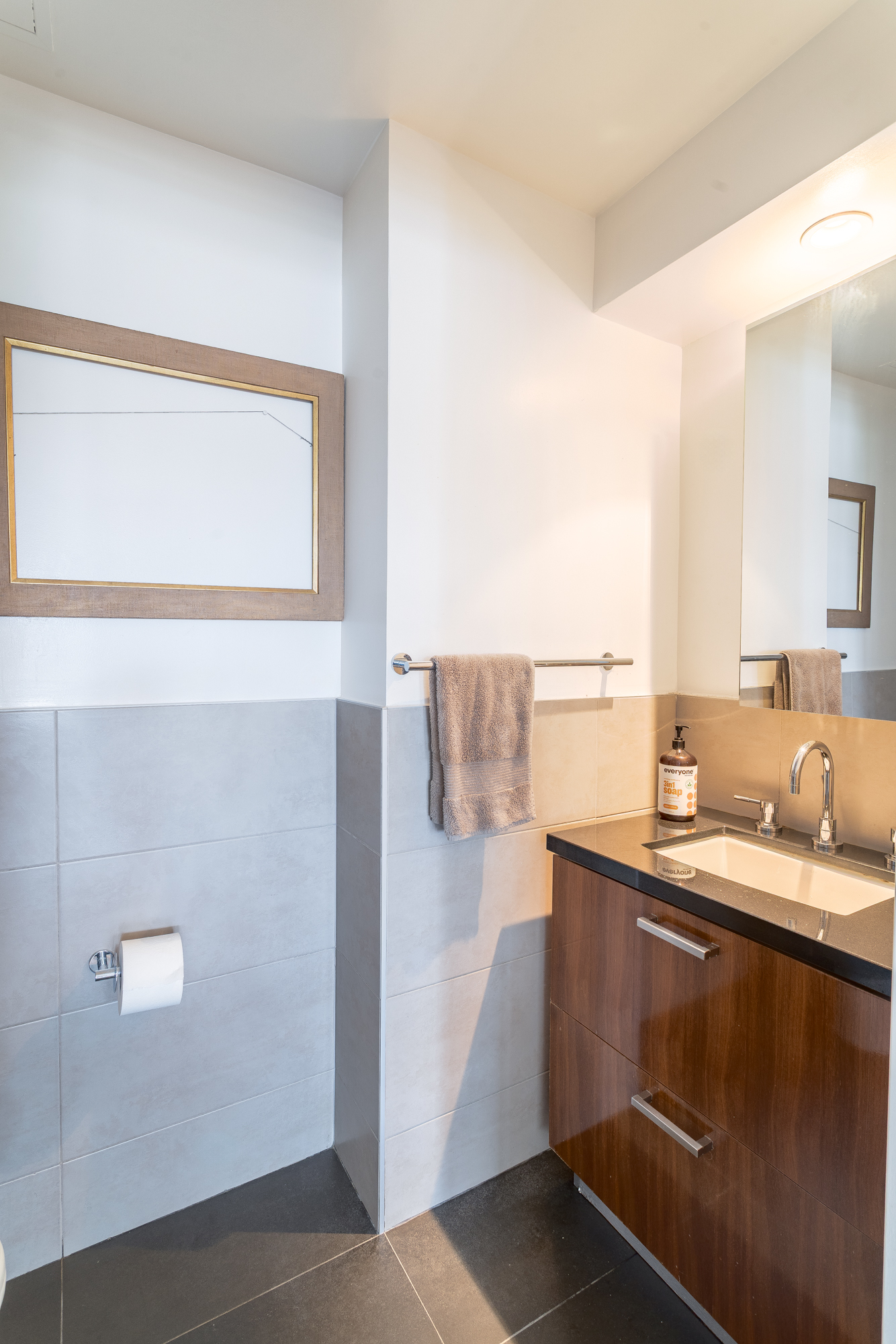 560 Carroll Street, Unit 11A Brooklyn, NY 11215 - Photo 7 of 15 a bathroom with a sink a mirror and a shower