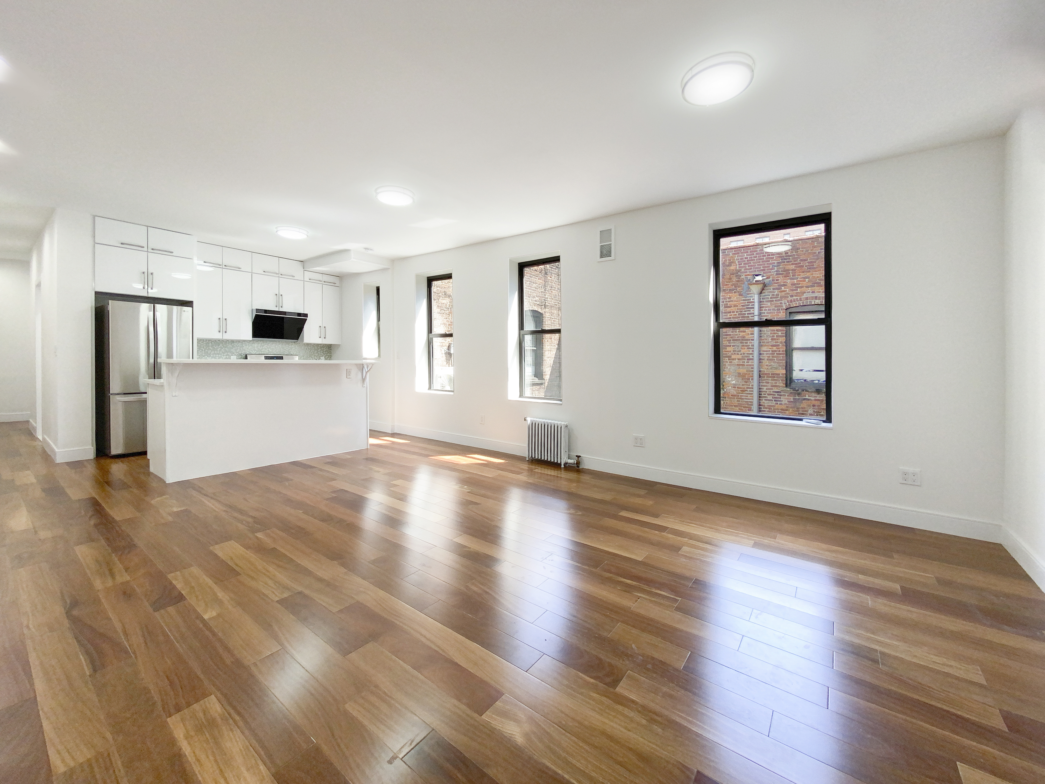 200 West 109th Street, Unit E4 Manhattan, NY 10025 - Photo 2 of 13 a view of a kitchen with a sink and a refrigerator