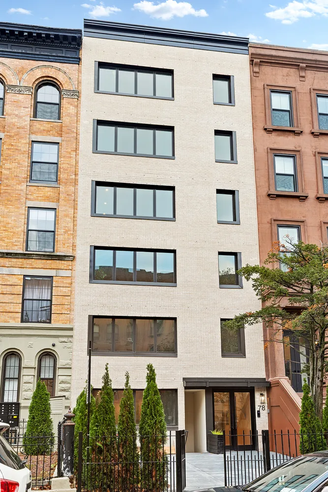 a front view of a building with a lot of windows