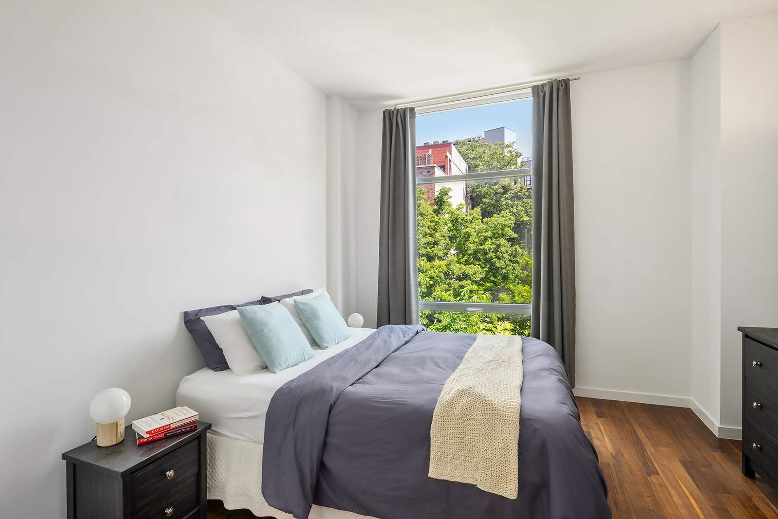 280 Metropolitan Avenue, Unit 3E Brooklyn, NY 11211 - Photo 4 of 12 a bedroom with a bed and a window