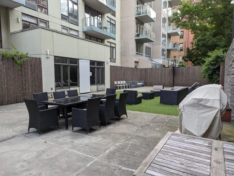 a view of a patio with couches table and chairs